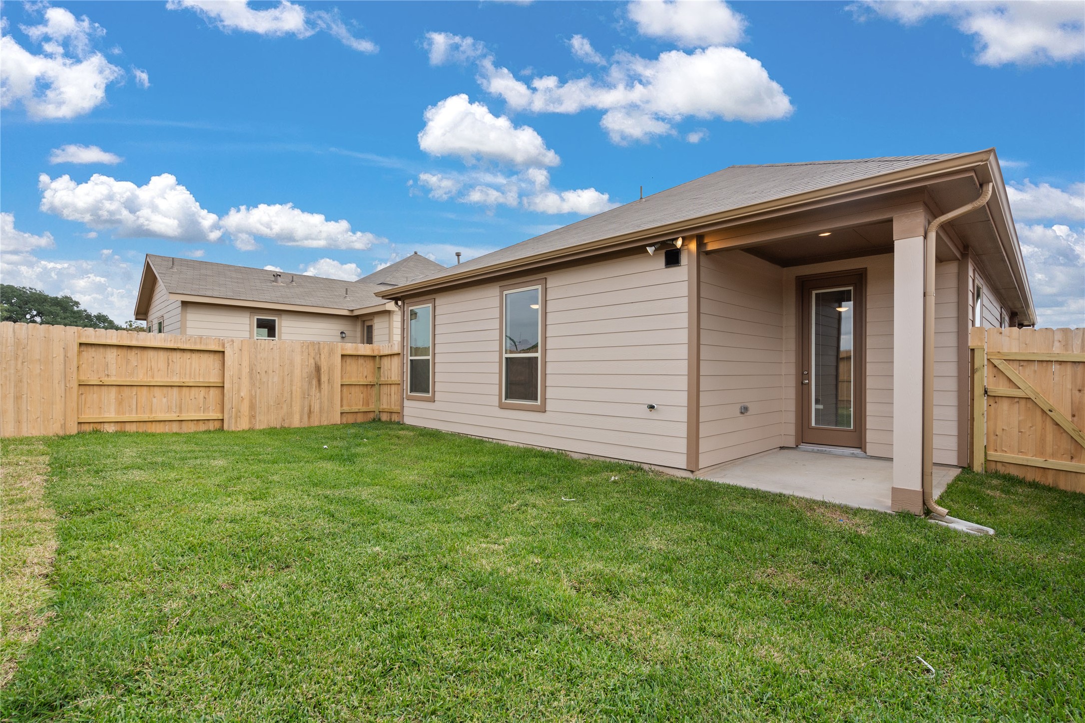 Come and see this spacious backyard with its beautiful covered patio. There is plenty of room for the kids to play and adults to relax! Perfect for your outdoor living space, patio furniture, bbq pit, and so much more. The possibilities are endless!
