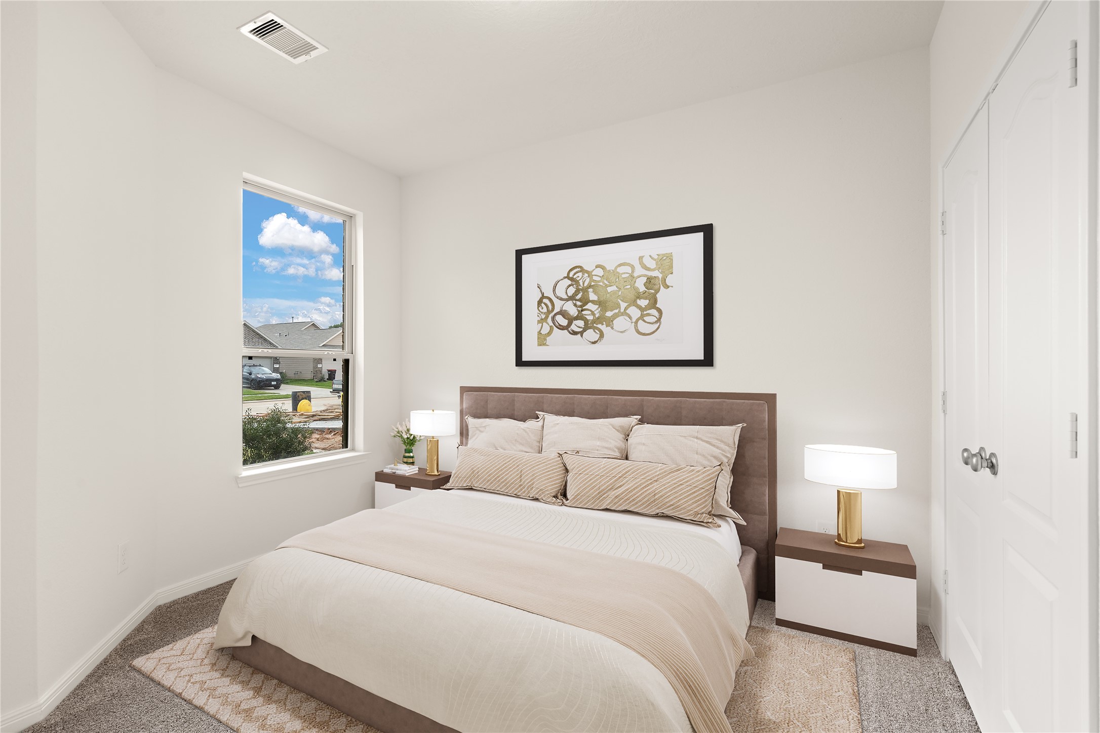 Secondary bedroom features plush carpet, custom paint and a large window.