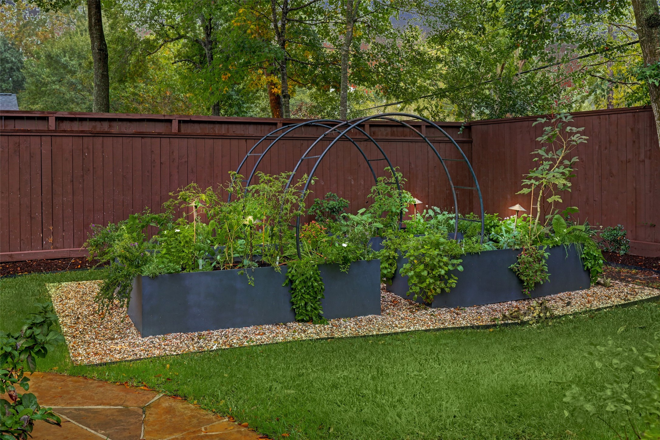 There is little more delectable than home-grown veggies.  Here is a custom designed Garden where you can grow your own! Just beyond the Garden is a whole house, natural gas-fired Generator so, in the event of a power outage, you don't have to eat your veggies in the dark!