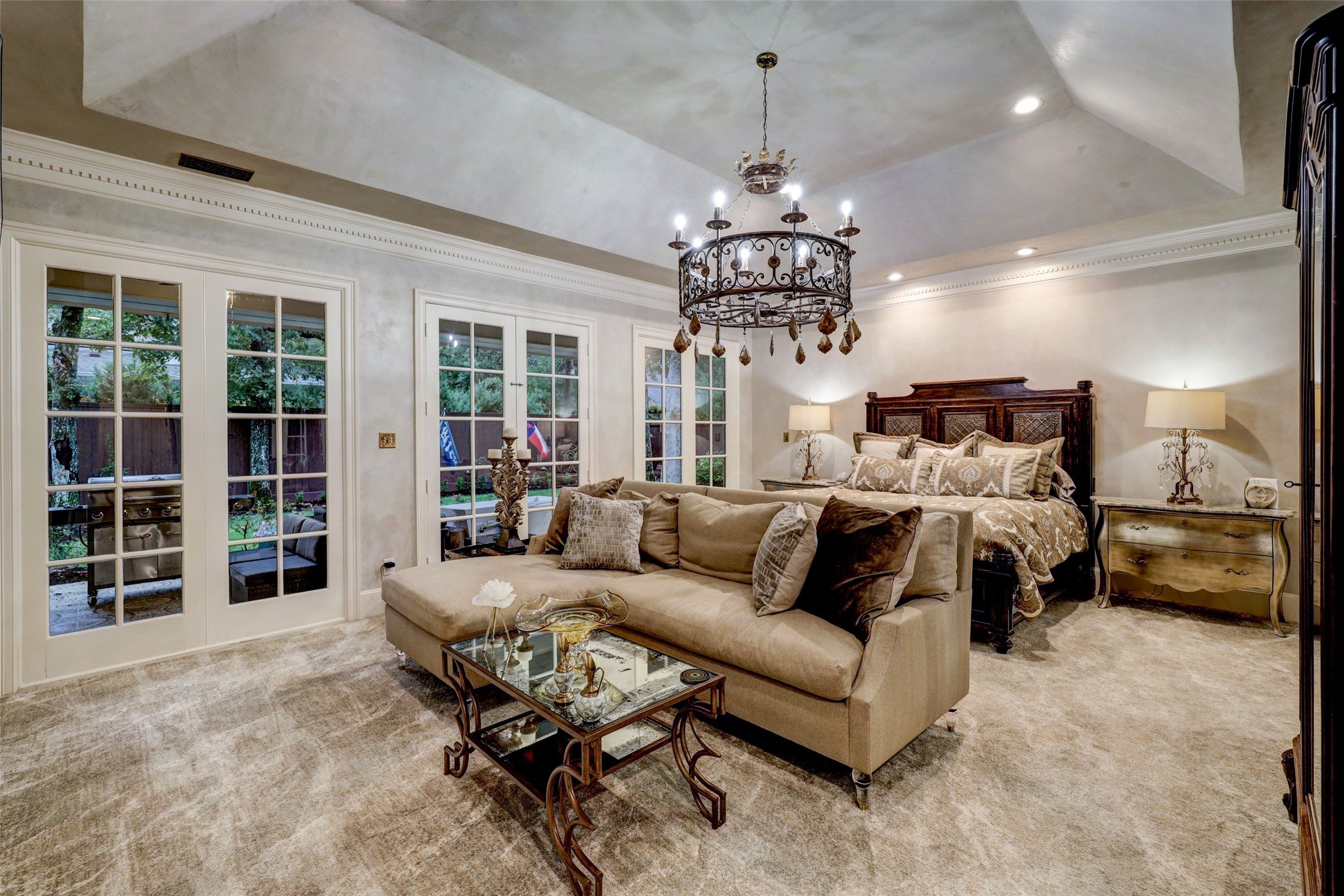 Ravishing and cloistered is the über serene and luxurious Master Suite. Walls are swathed with Diamond Brite custom plaster, as is the vaulted ceiling above. Access to the Pool is through a set of French Doors.