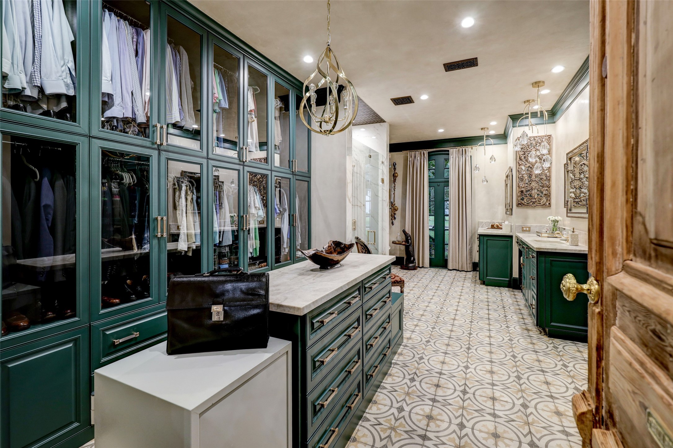 Walking through the antique door--from Joyce Horn--you are magically transported to a stunning space that is both luxurious and practical. The Master Bath and Closet were taken to the studs and methodically recomposed to create this truly breathtaking place.