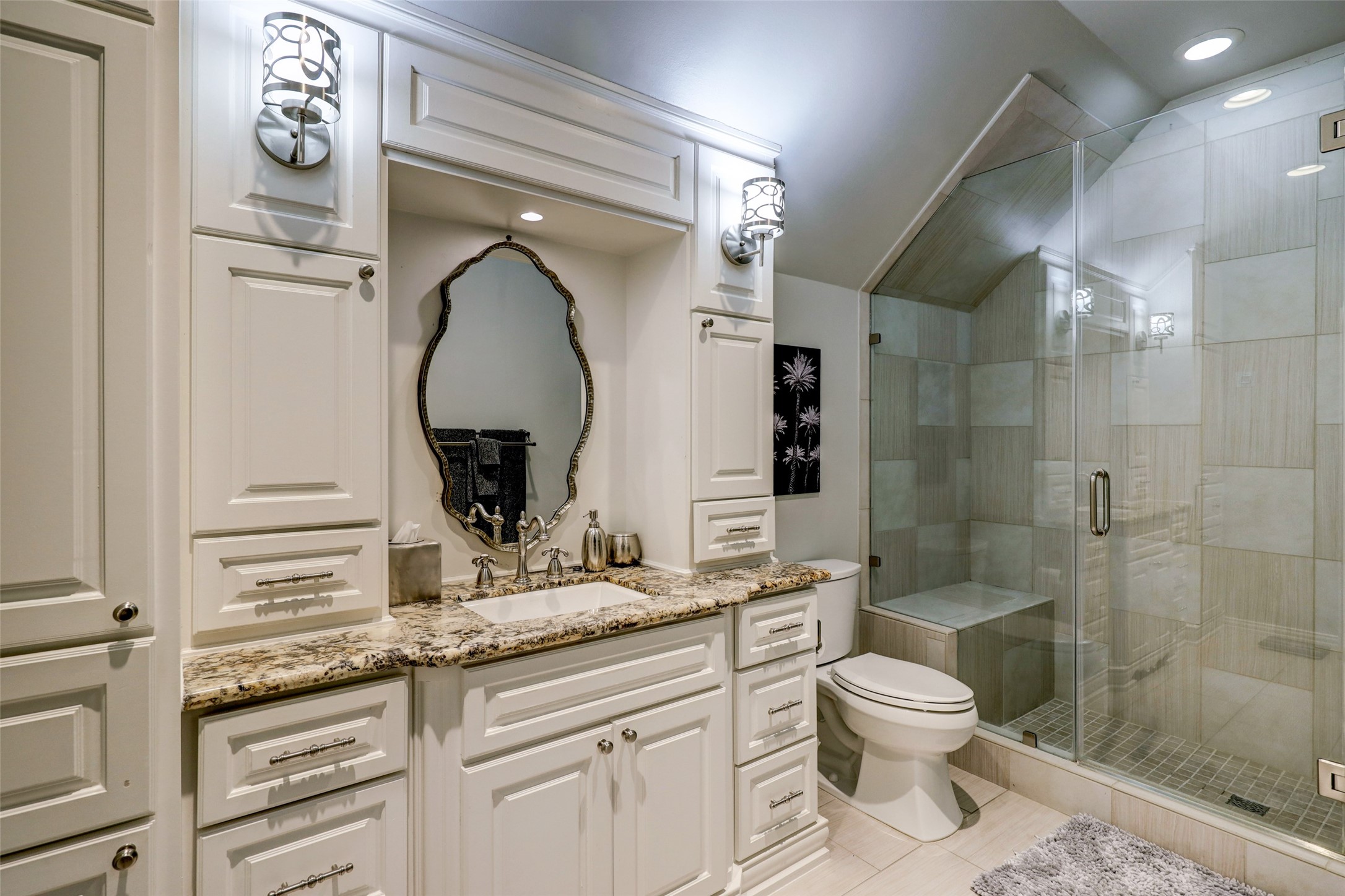 ...an updated Bath with oversized Shower and custom Vanity...