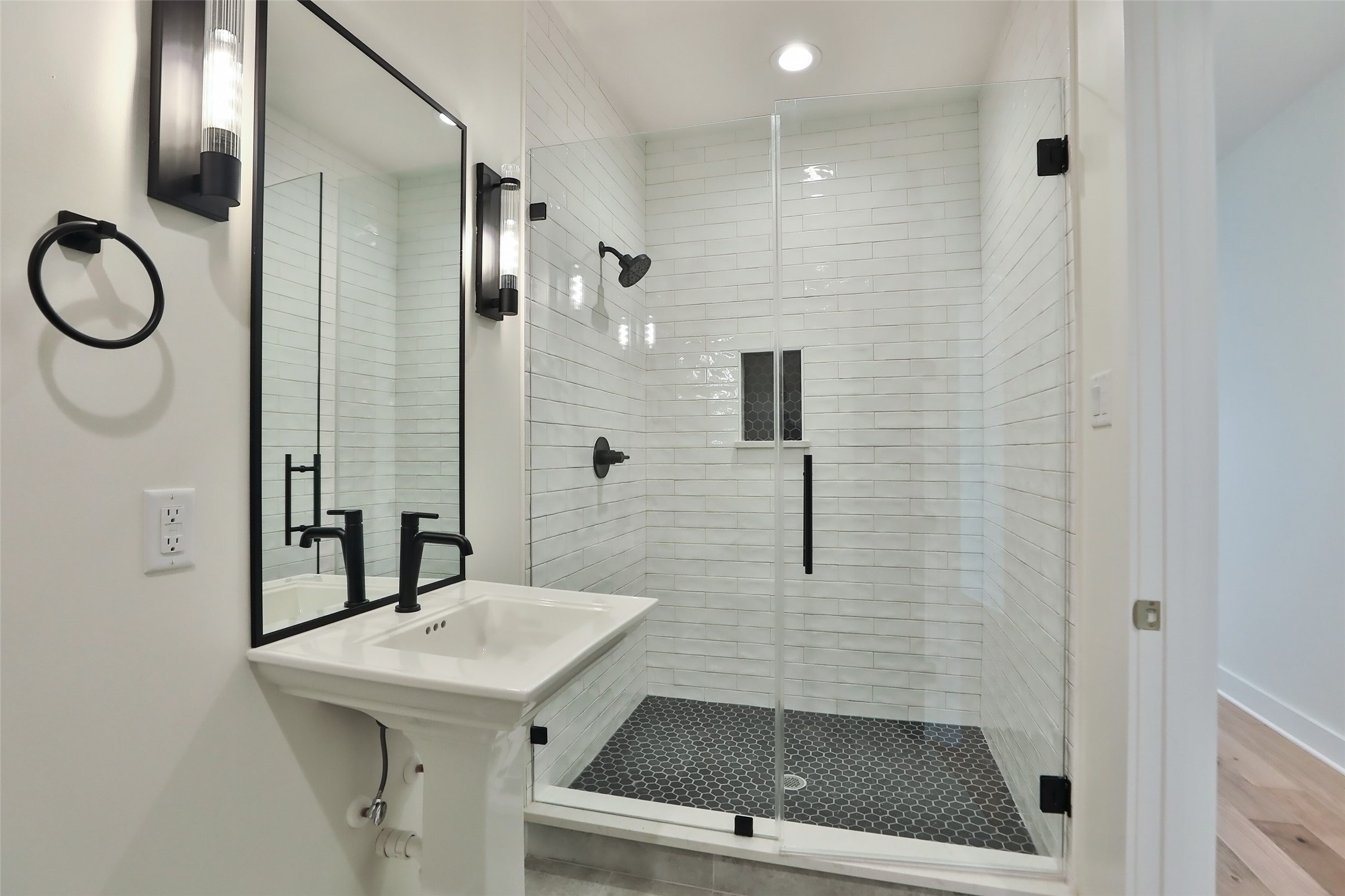 This full bathroom is located on the second floor in the back of the home adjacent to the large room.