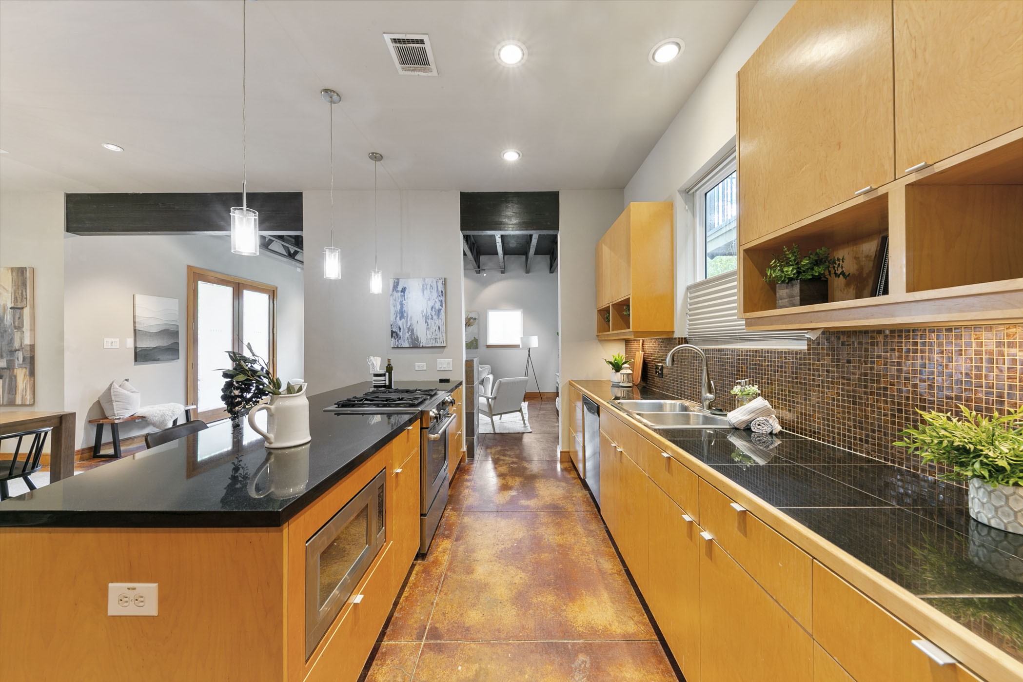The kitchen features a custom mosaic backsplash!