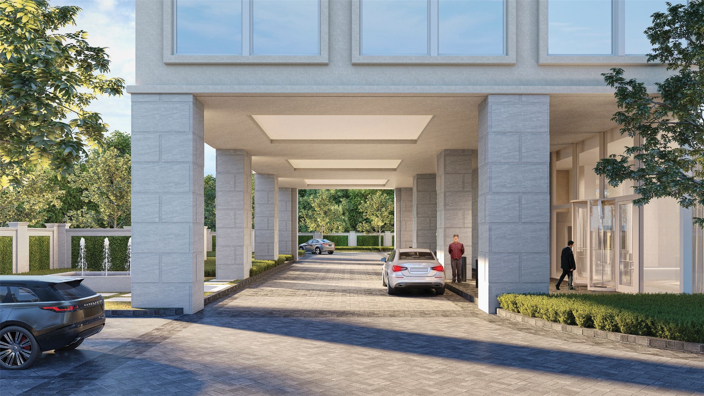 Just passed the 8 ft. ivy-clad privacy wall that completely engulfs the building's perimeter, residents and guests alike find the grand, dual entry/exit porte-cochere where the valet awaits to take it from here.