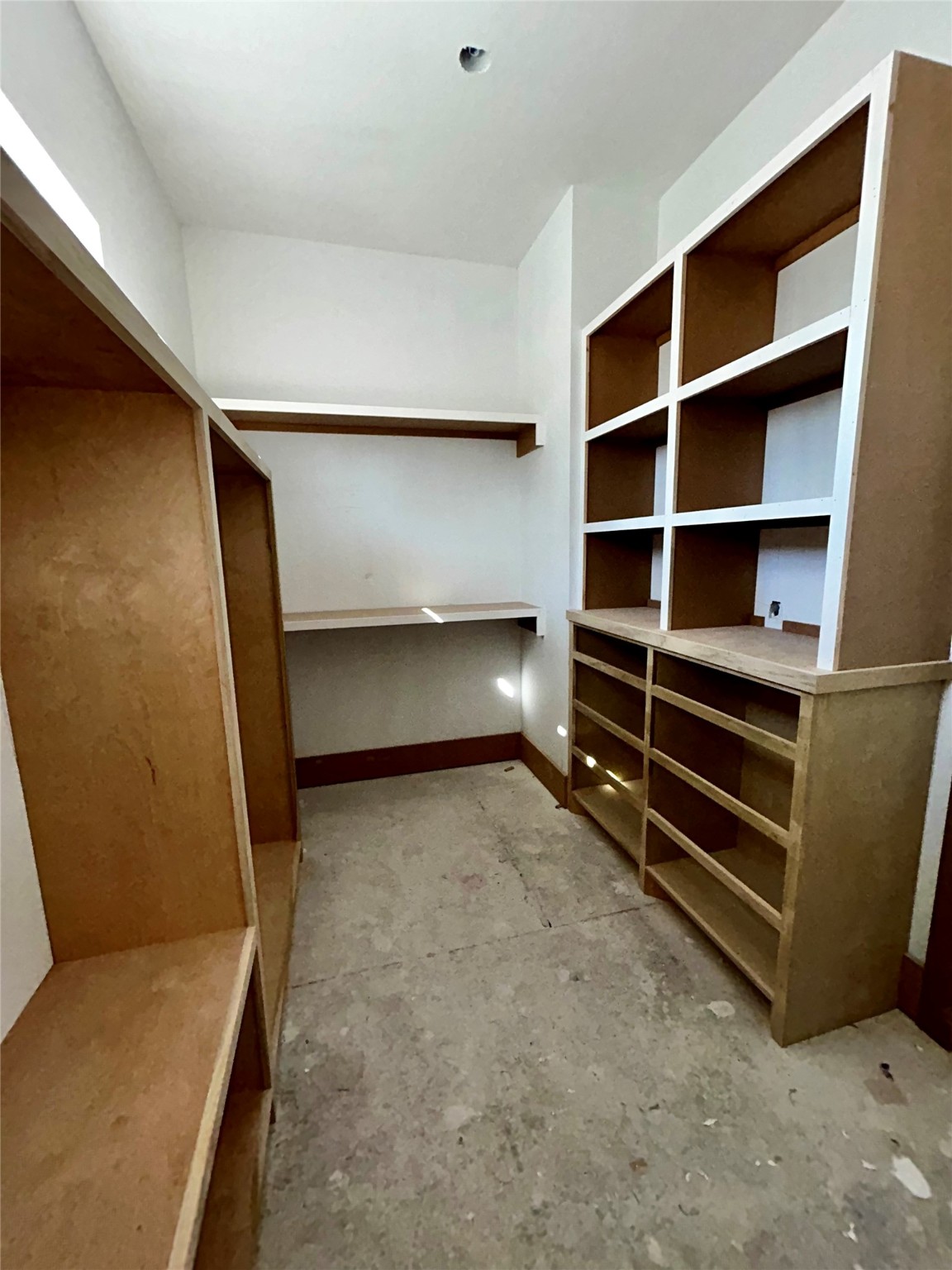 One of 2 walk-in closets in the primary bedroom.