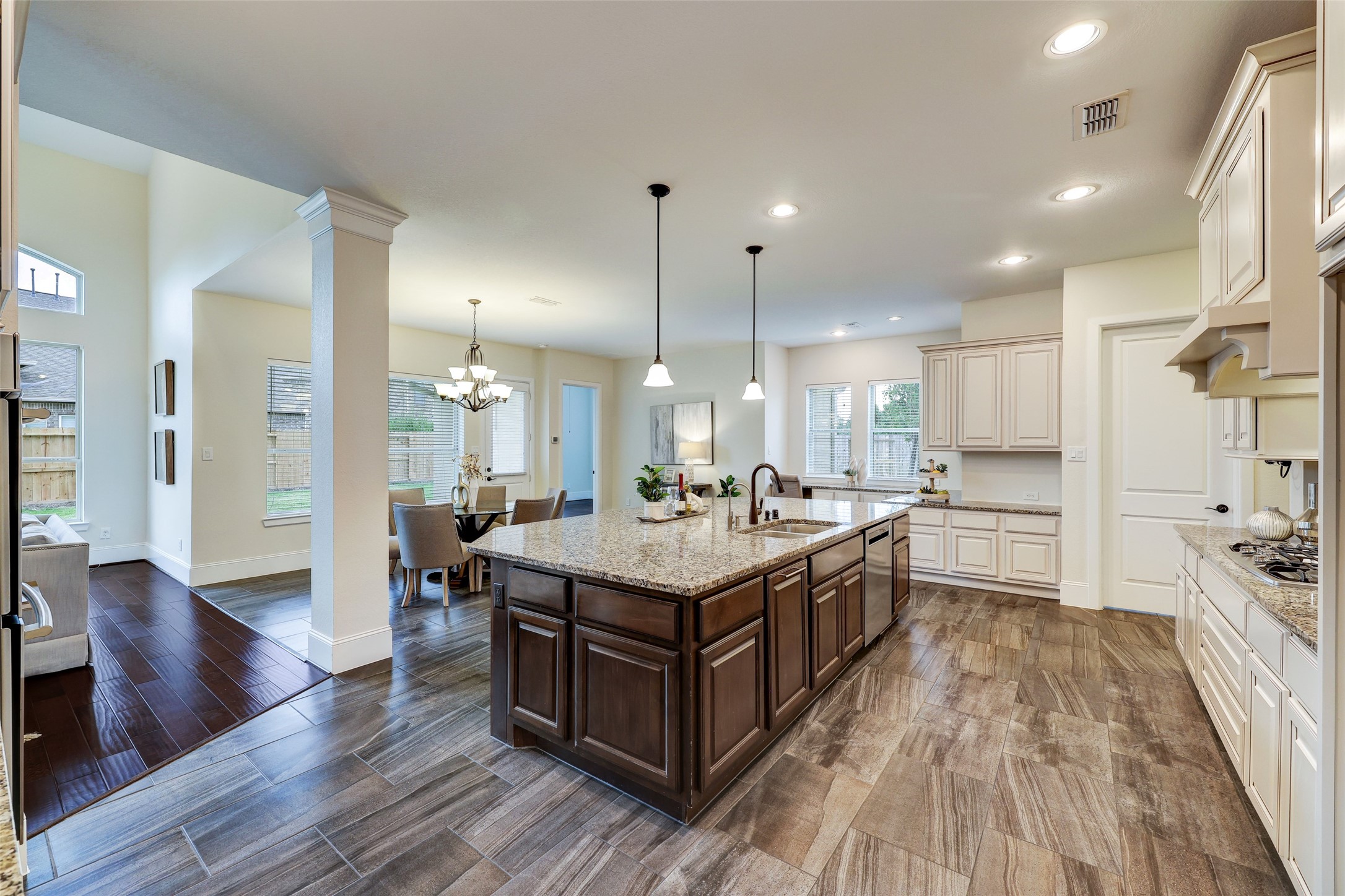 Efficiency is maximized in this gourmet island kitchen with ample cabinetry and countertop space. Open to the breakfast room and family room, this space is well appointed for entertaining guests.