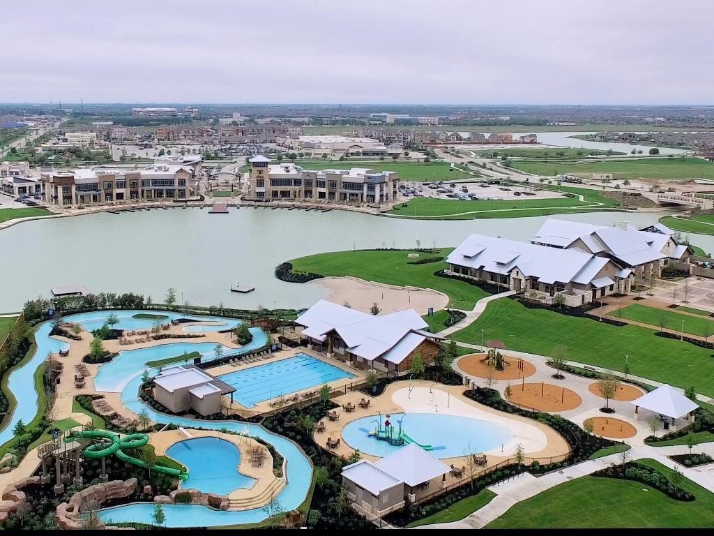 Towne Lake offers ample amenities, like an Olympic sized swimming pool, multiple splash pads across the community, a water park  with lazy river, tennis courts, a beach island and many parks.