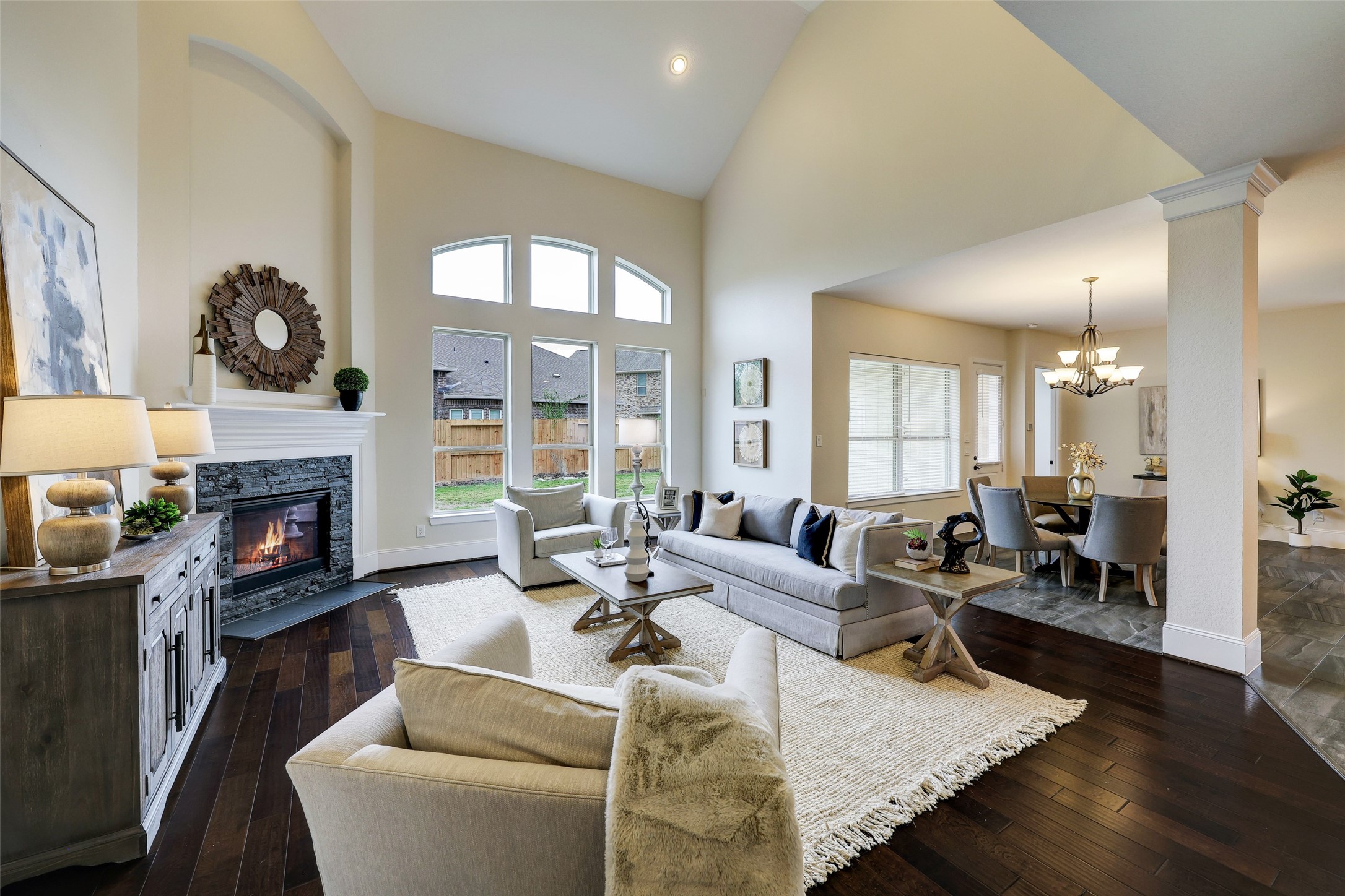 Entertain effortlessly in the soaring 2-story family room, where an open concept design fosters a sense of togetherness and shared experiences.