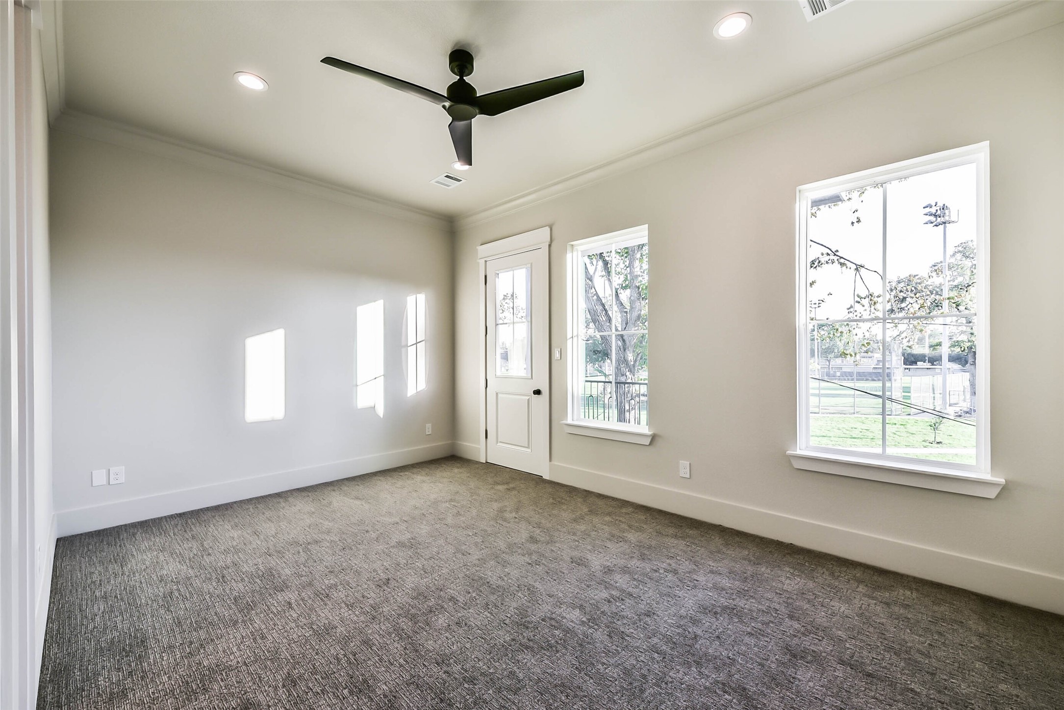 Large secondary bedrooms with high ceilings, recessed lights and divided light windows.