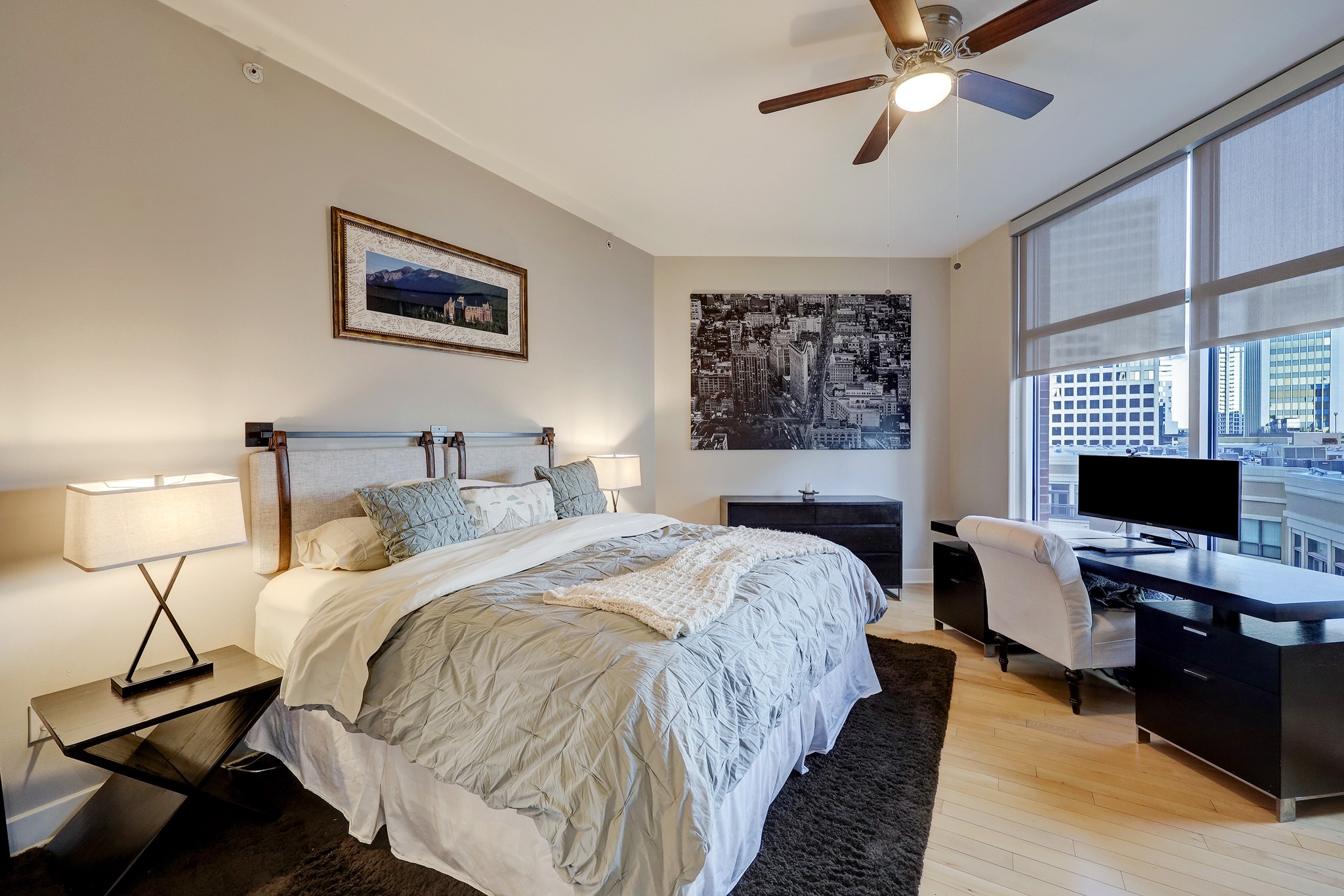 The second bedroom is spacious and features large windows and an ensuite bathroom. This bedroom is also larger enough for a workstation or sitting area.