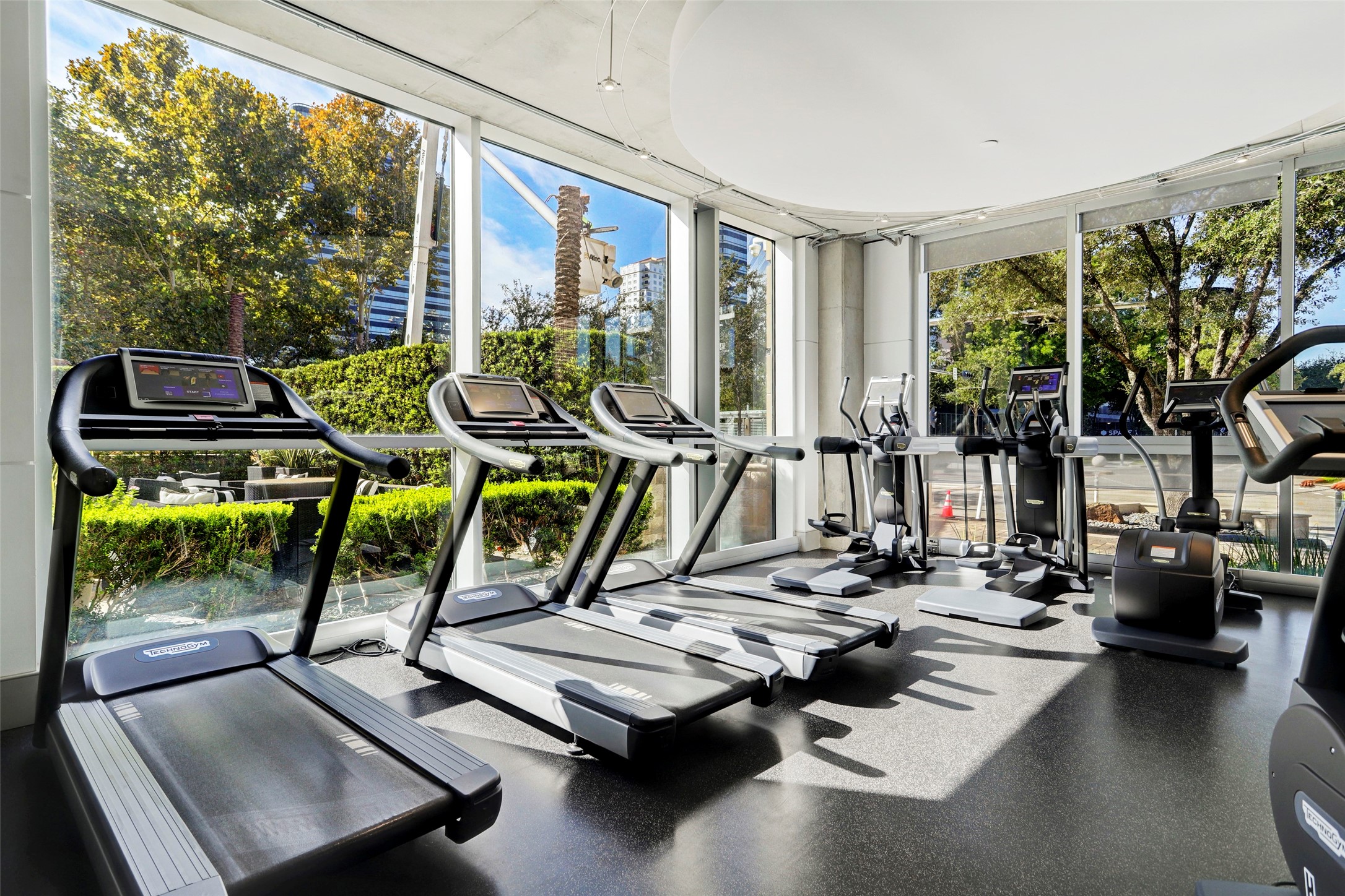 Plenty of cardio equipment in this 24-hour secured fitness center. Floor-to-ceiling windows so you can enjoy the outdoors while working out.