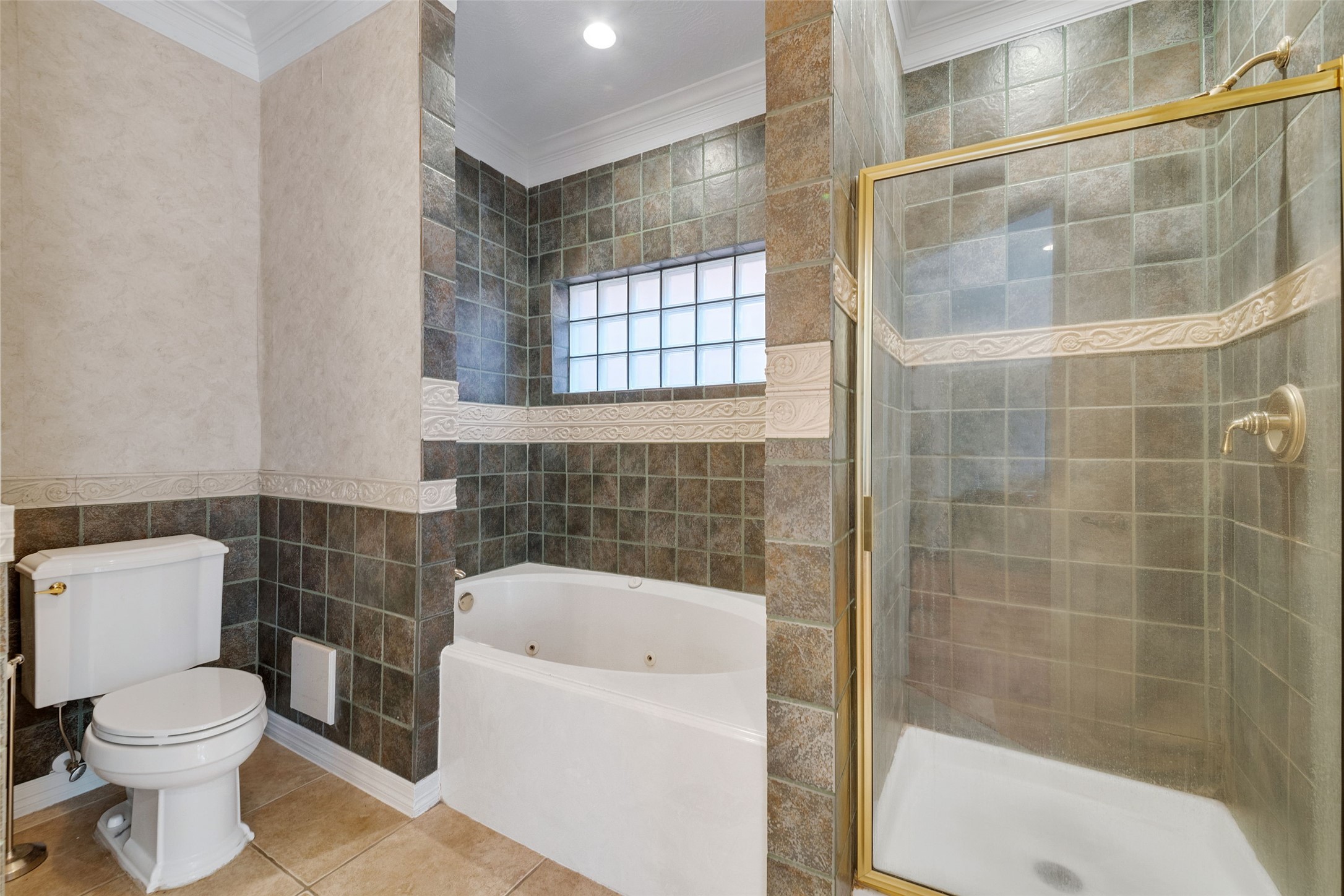 The primary en-suite bathroom has separate shower and jetted tub for ultimate relaxation.