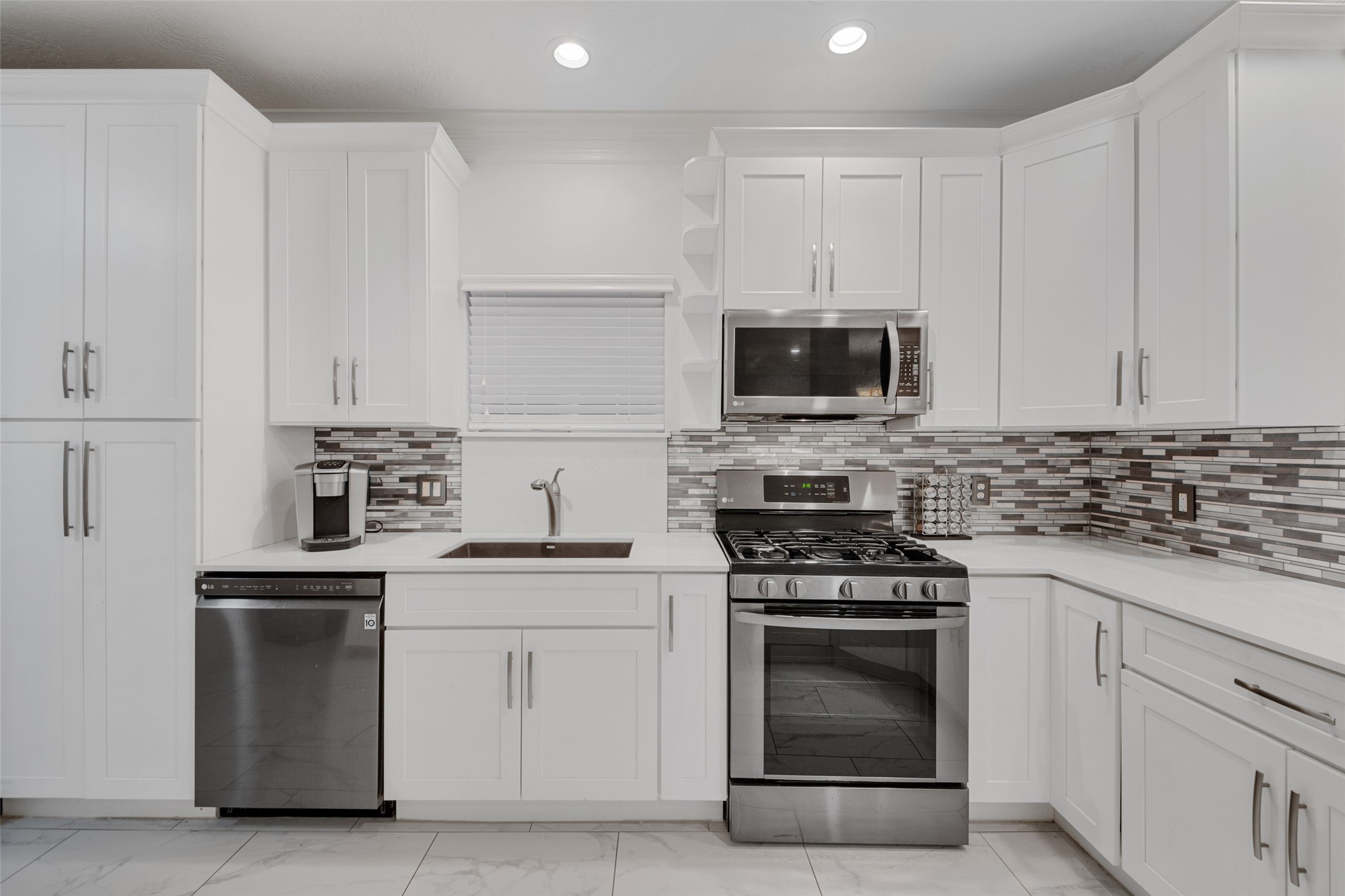 This thoughtfully constructed kitchen, complete with pantry space, will satisfy any cook's needs.