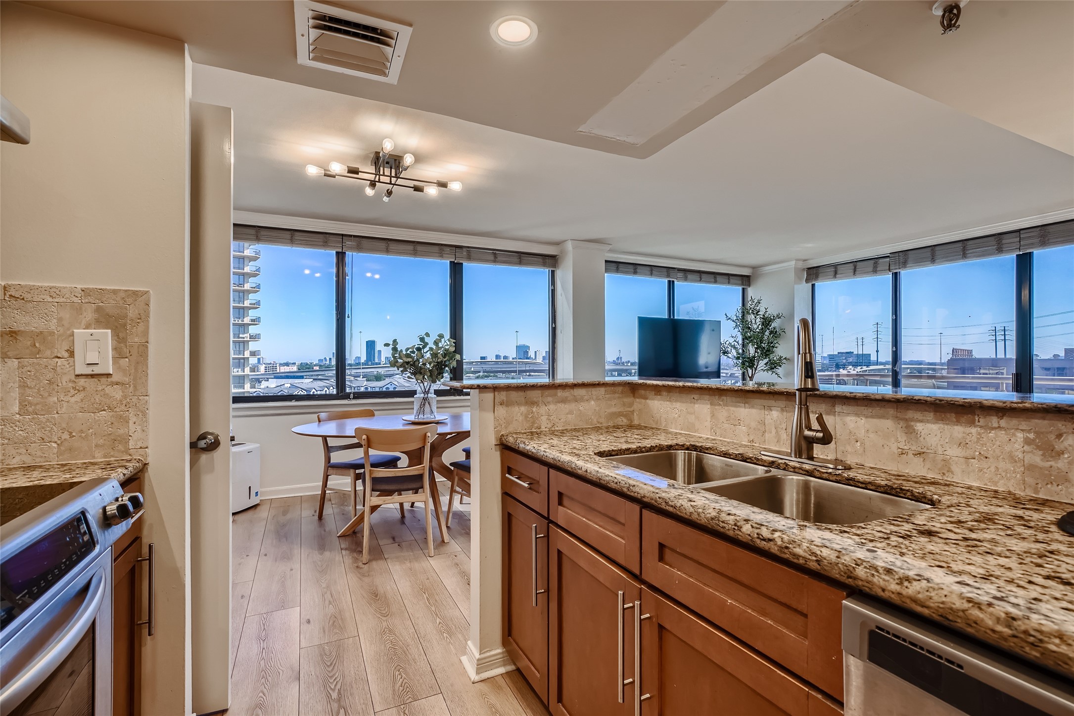 Indulge in the stunning views as you prepare meals in this kitchen, whether it's during a sunrise or at dusk.
