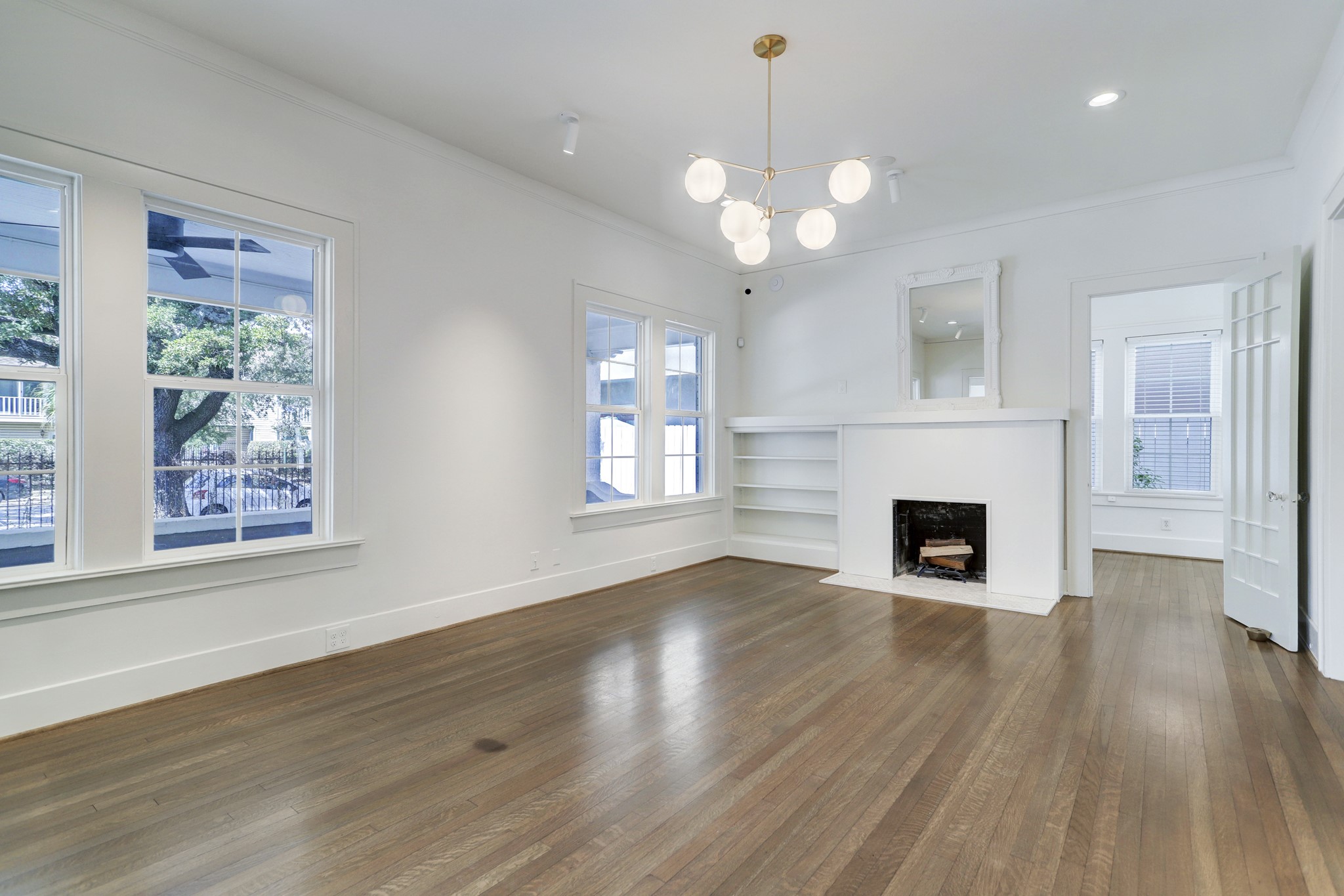 HIGH CEILINGS AND WOOD FLOORS ARE COMPLIMENTED WITH LOTS OF NATURAL LIGHT AND A COZY FIREPLACE!