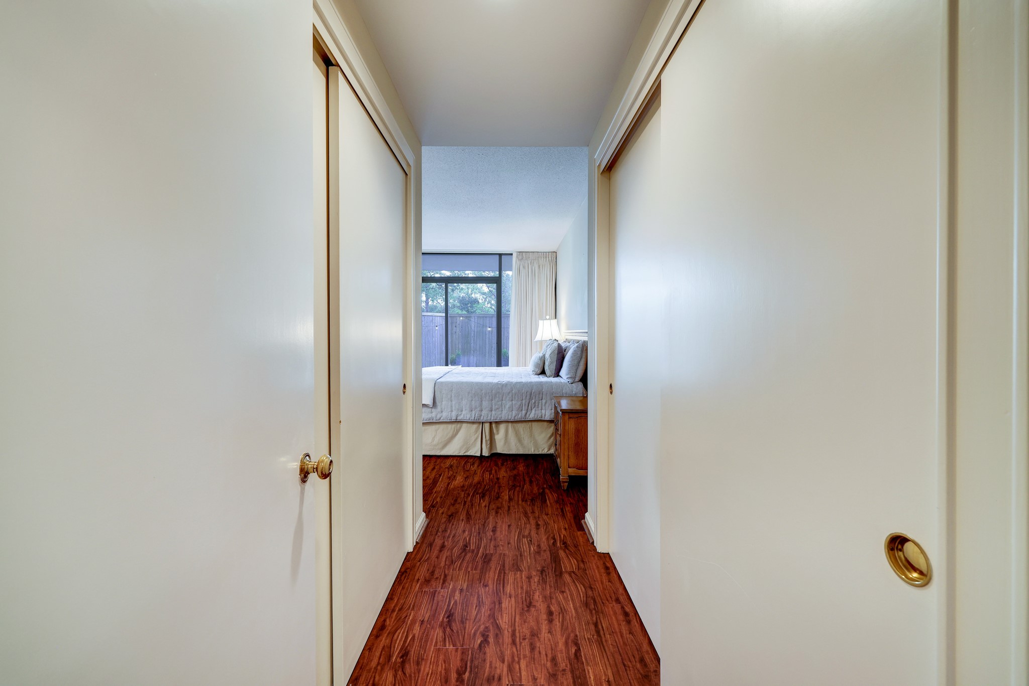 Entry to third bedroom has two spacious closets with sliding doors.