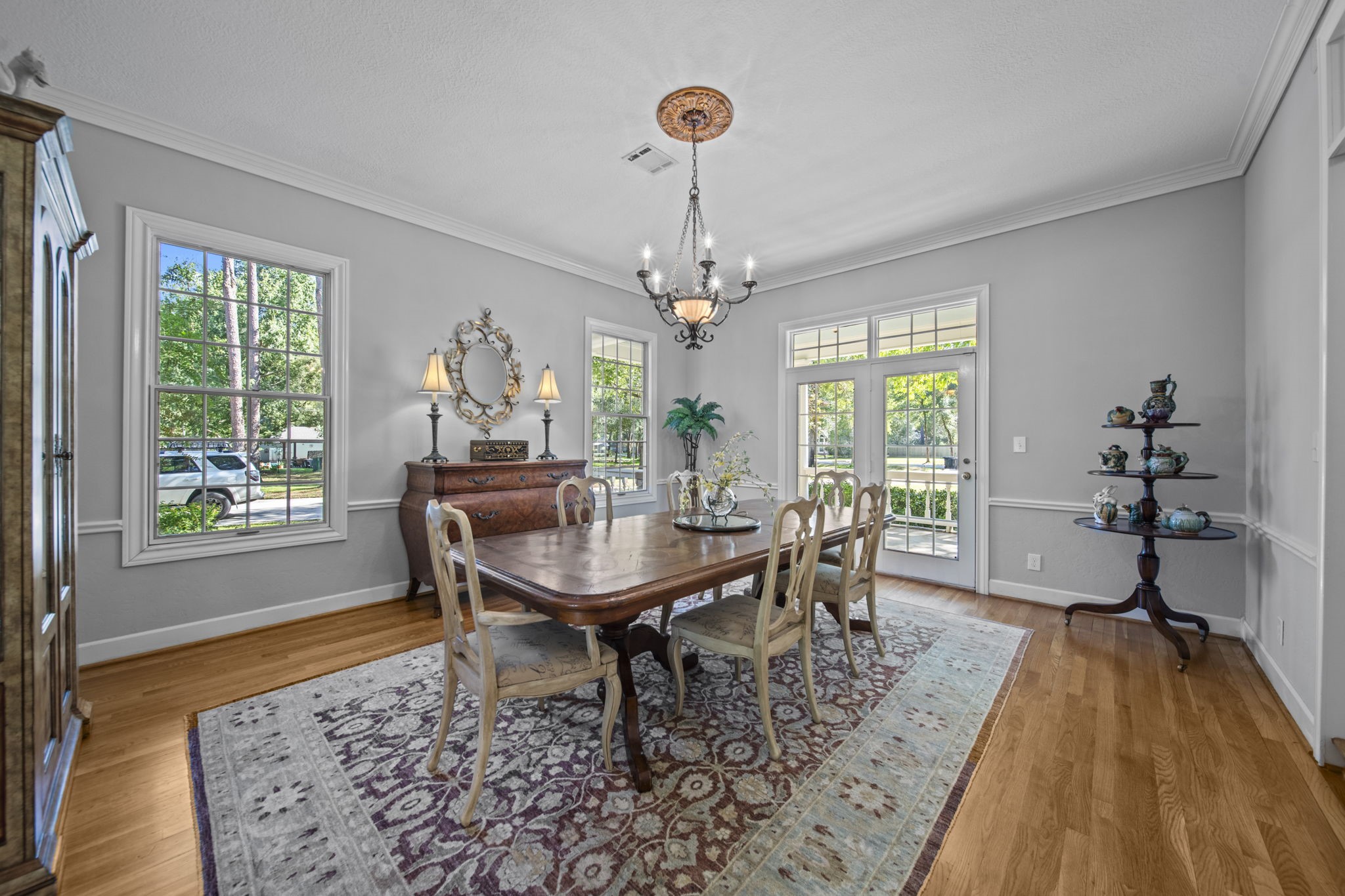 Formal dining area with doors leading out to the front porch. Excellent room for hosting formal or informal dinner parties. This room has large windows and extra doors that lets lots of natural light into the home.
