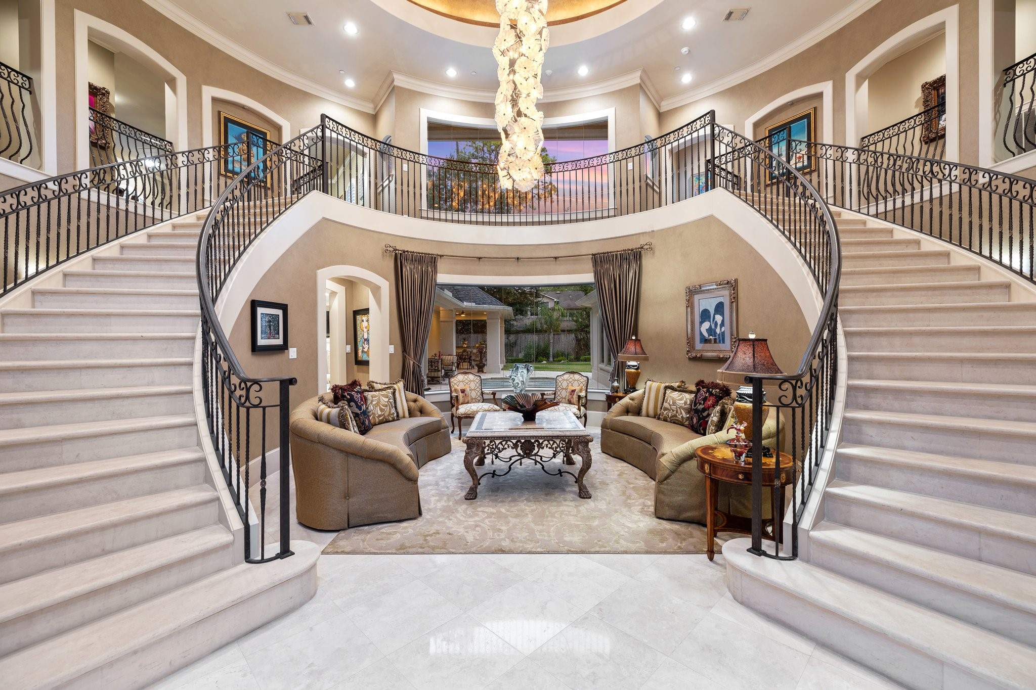 This prestigious residence combines grandeur with modern living. The front entry with dual limestone staircases exudes timeless elegance.