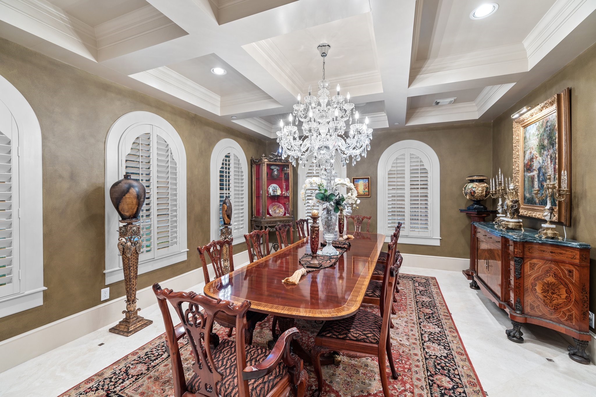 The expansive formal dining room comfortably accommodates a large dining table, perfect for hosting grand dinner parties or intimate family gatherings.