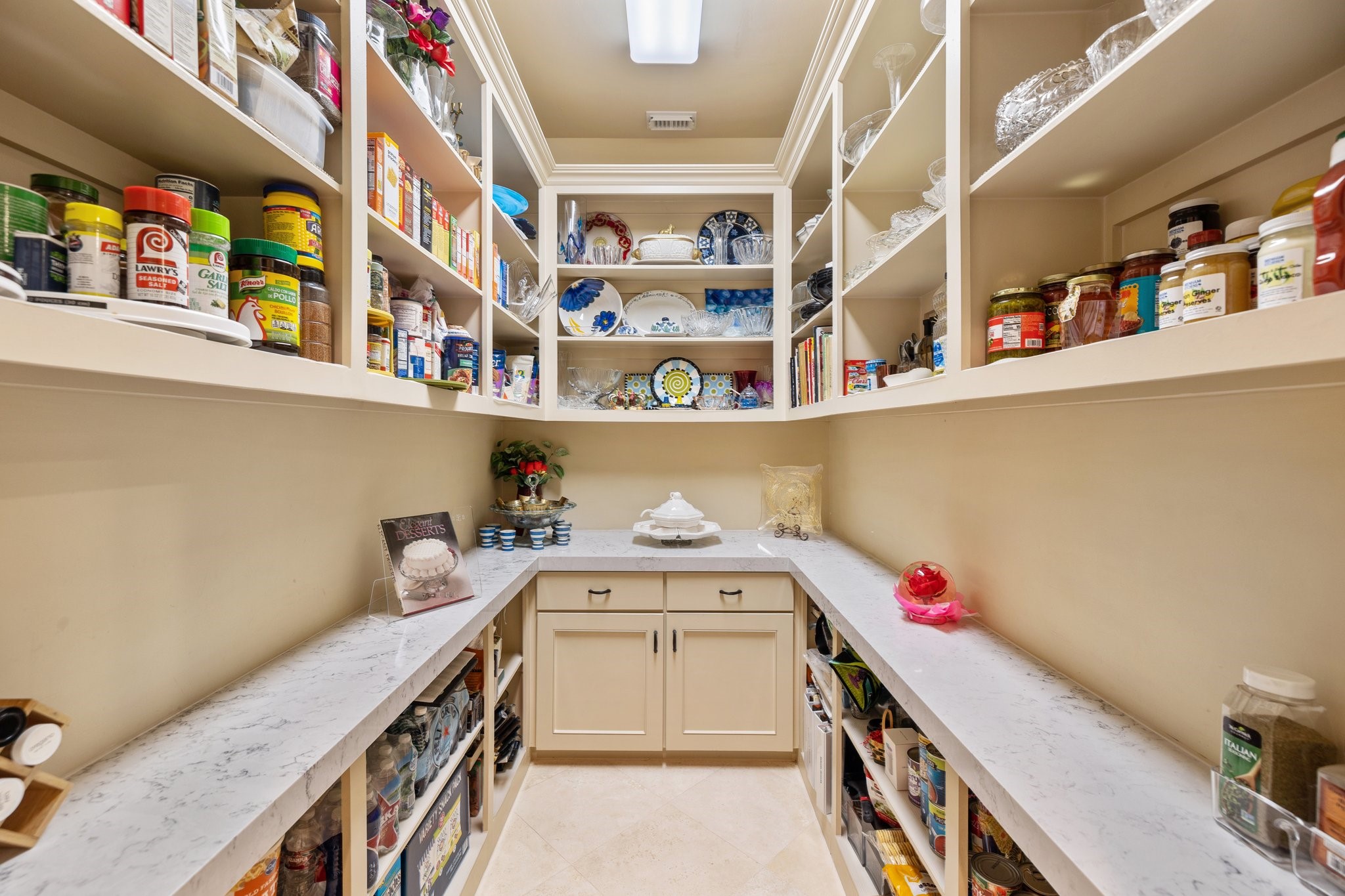 Uncover a host's dream in the walk-in pantry, a generous space that marries functionality with design.