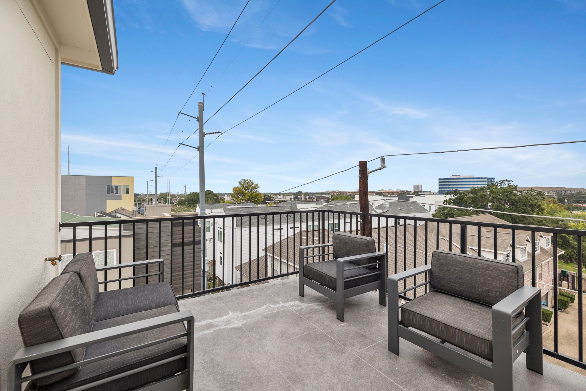 Elevate your outdoor living experience with the rooftop terrace, offering breathtaking Galleria views.