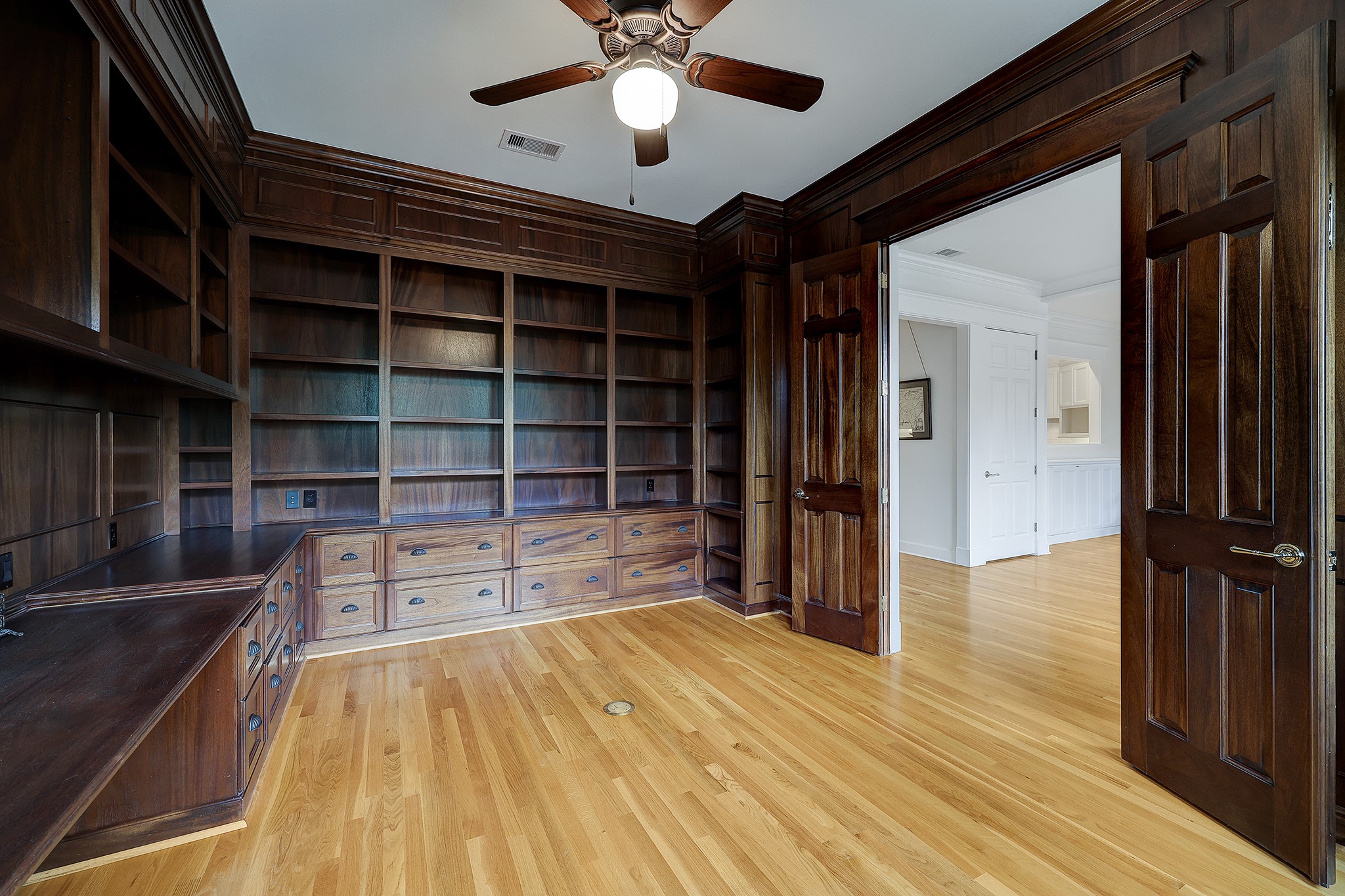 What would you use this large library / study / dining room for? A wine room perhaps? (virtually staged)
