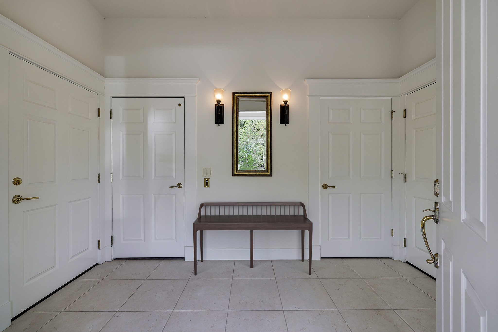 The charming foyer is your entrance to both stylish living and practical amenities, such as a central vacuum system, wired and wireless internet, hardscaped covered back patio with a small fenced yard, dual HVAC systems, dual hot-water heaters.