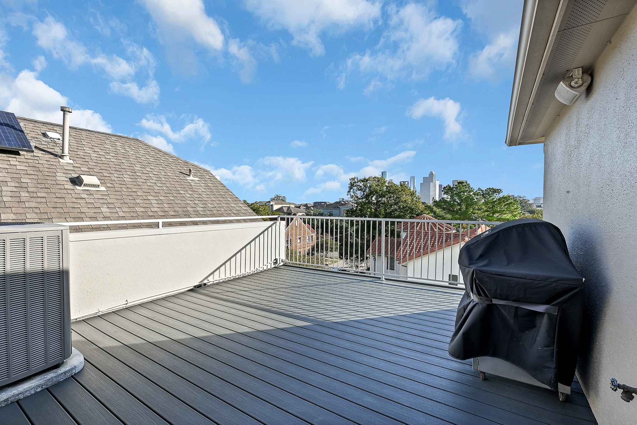 Spacious rooftop deck with breathtaking views of the city and gas line to hook up your grill.