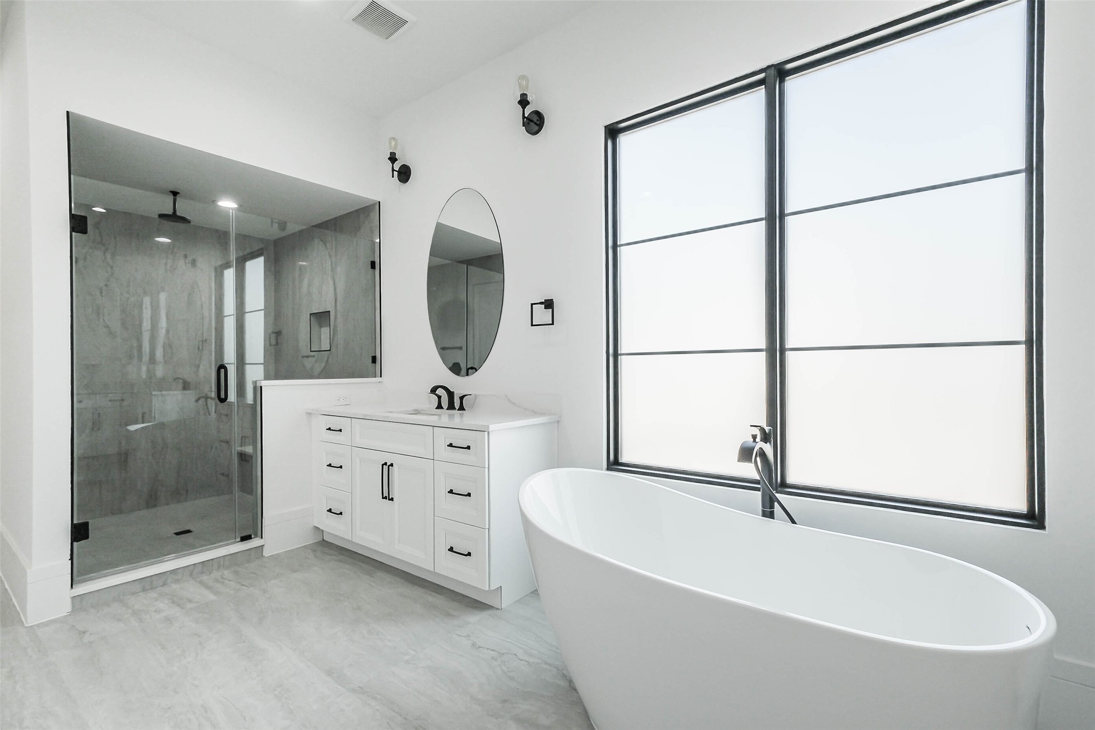 Primary Bath features Frameless Shower.