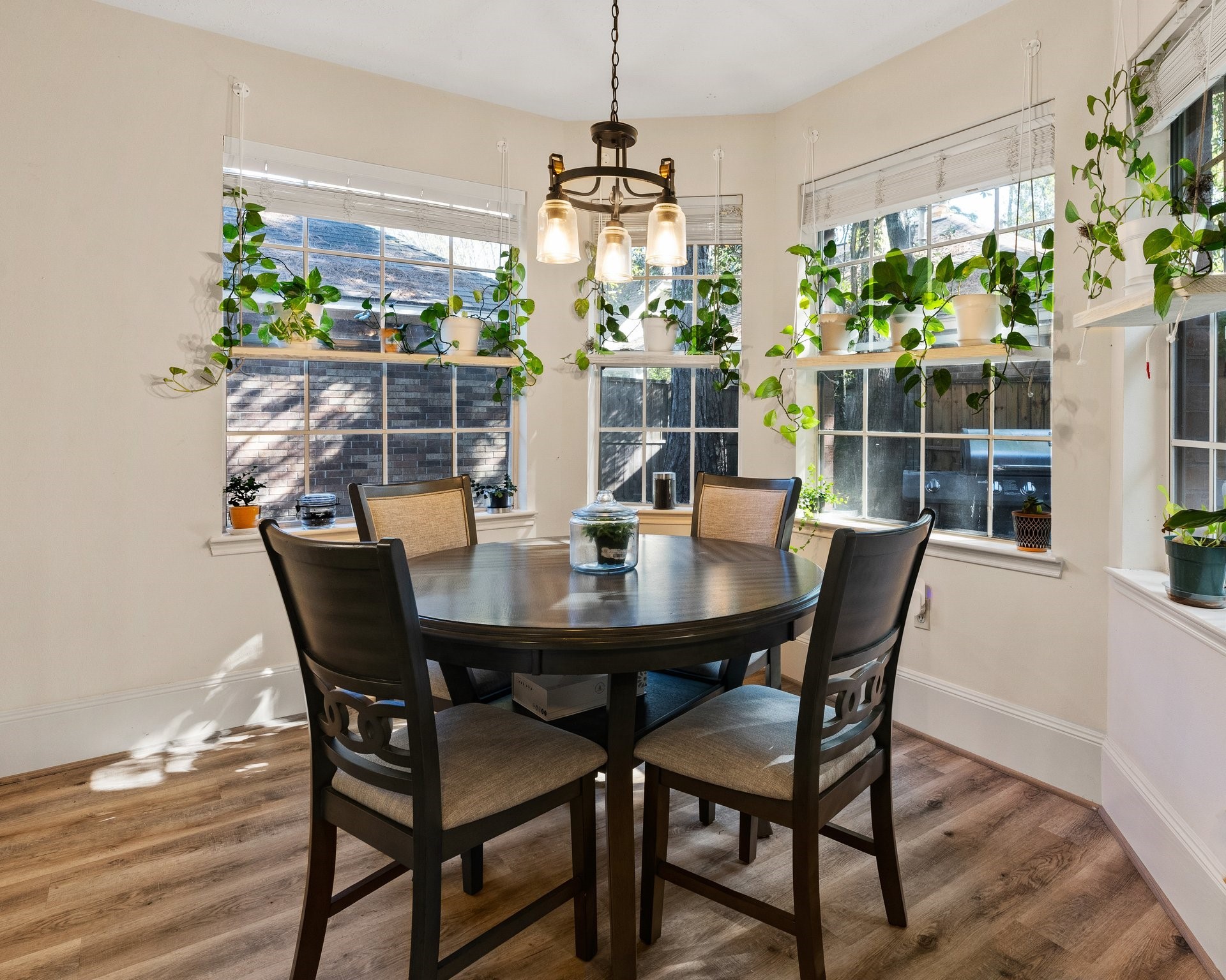 Sunny breakfast nook open to kitchen and sitting area