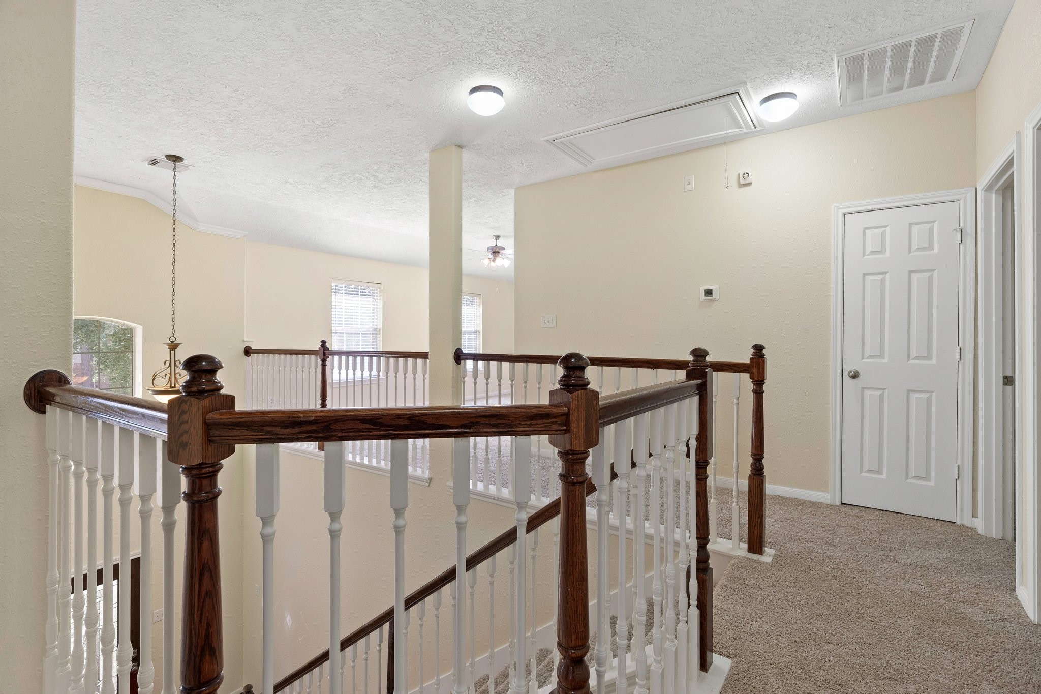 This is the hall upstairs with the game room at the front of the home and the door you see closed is to a linen closet.