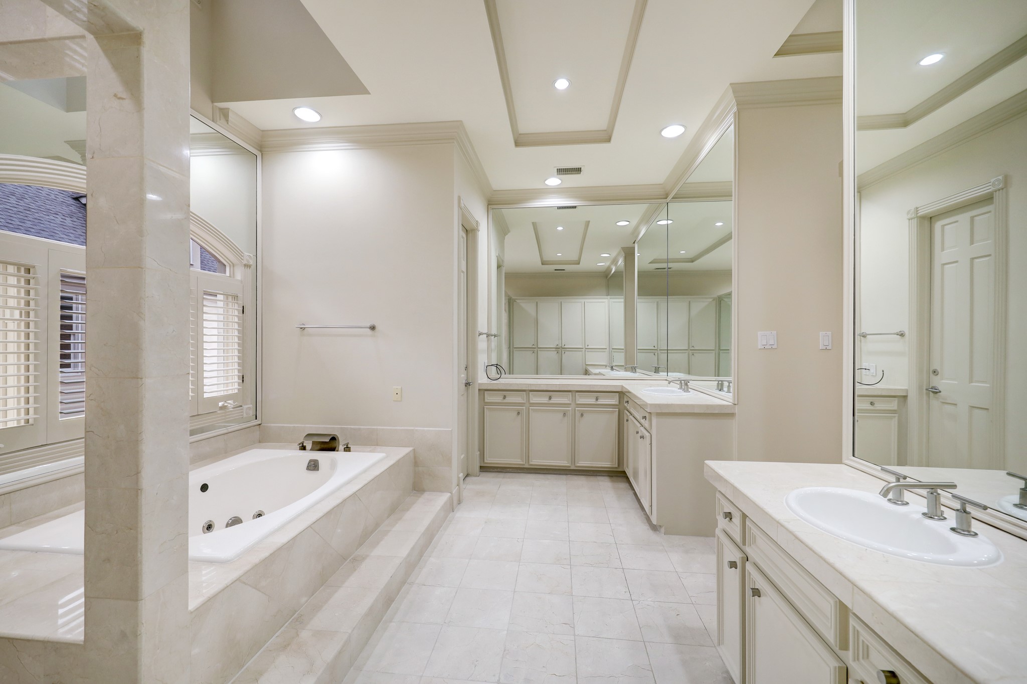 The double vanities with sinks allow for two people to use this primary bath with ease and comfort.