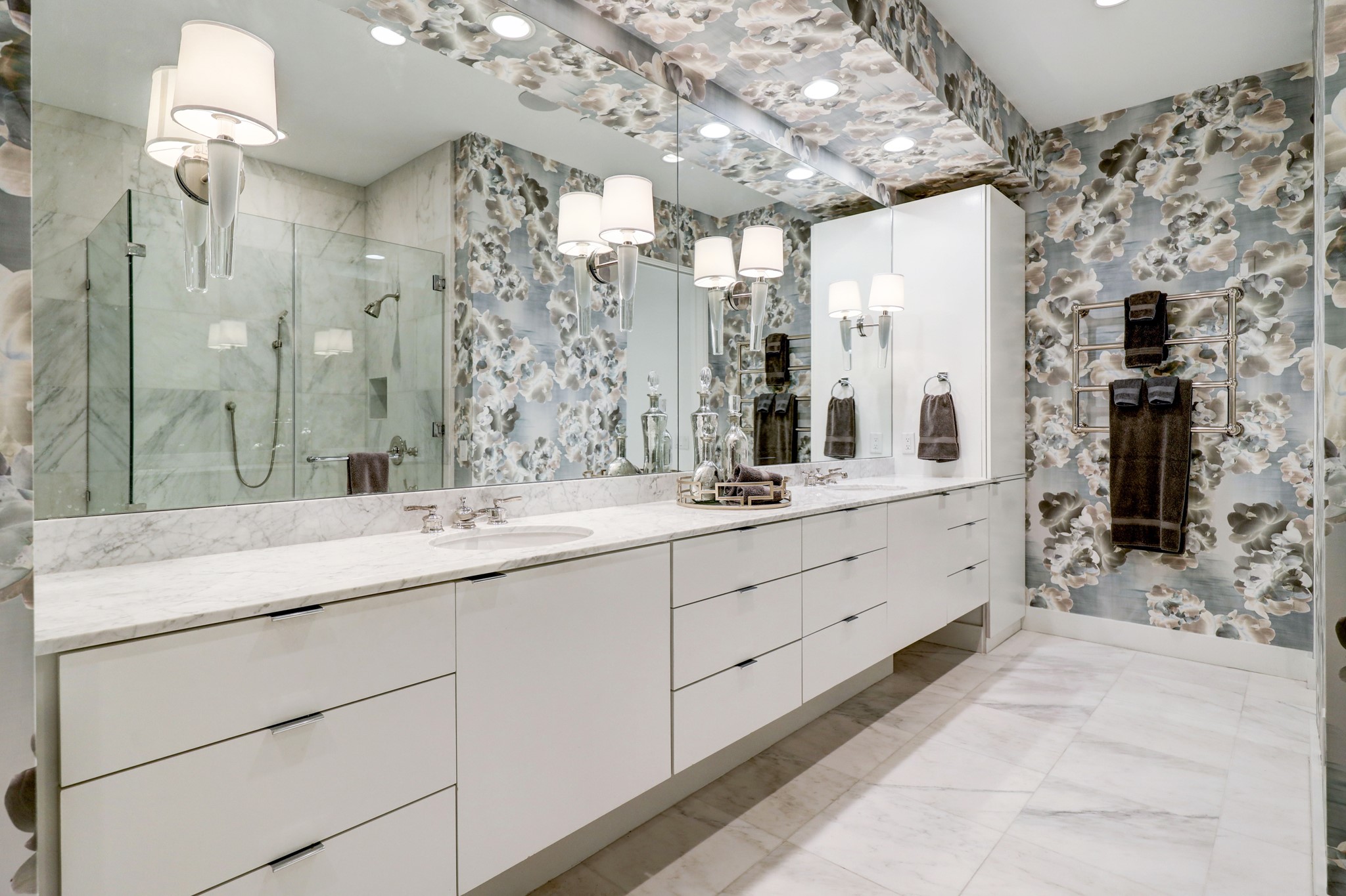 Nickel fixtures, designer sconces and a mounted towel heater!