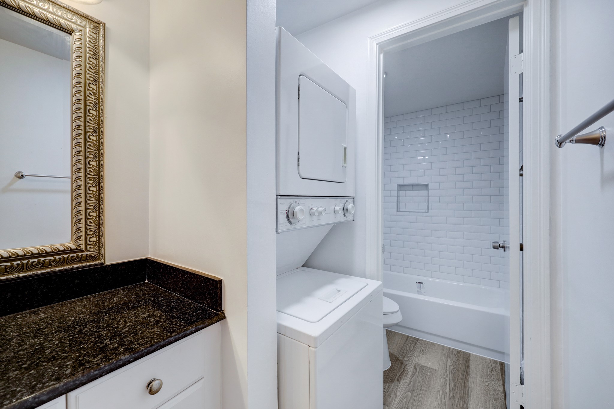 Primary Bathroom W/ Granite Countertop, Stack Washer/Dryer & New Bathtub & Tile