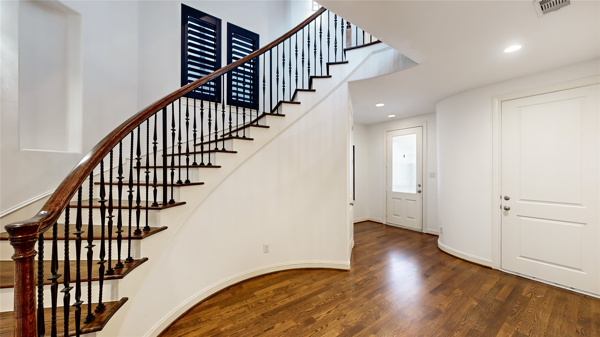 Beautiful hardwood flooring greets you as you enter into the impressive foyer with a stunning staircase.