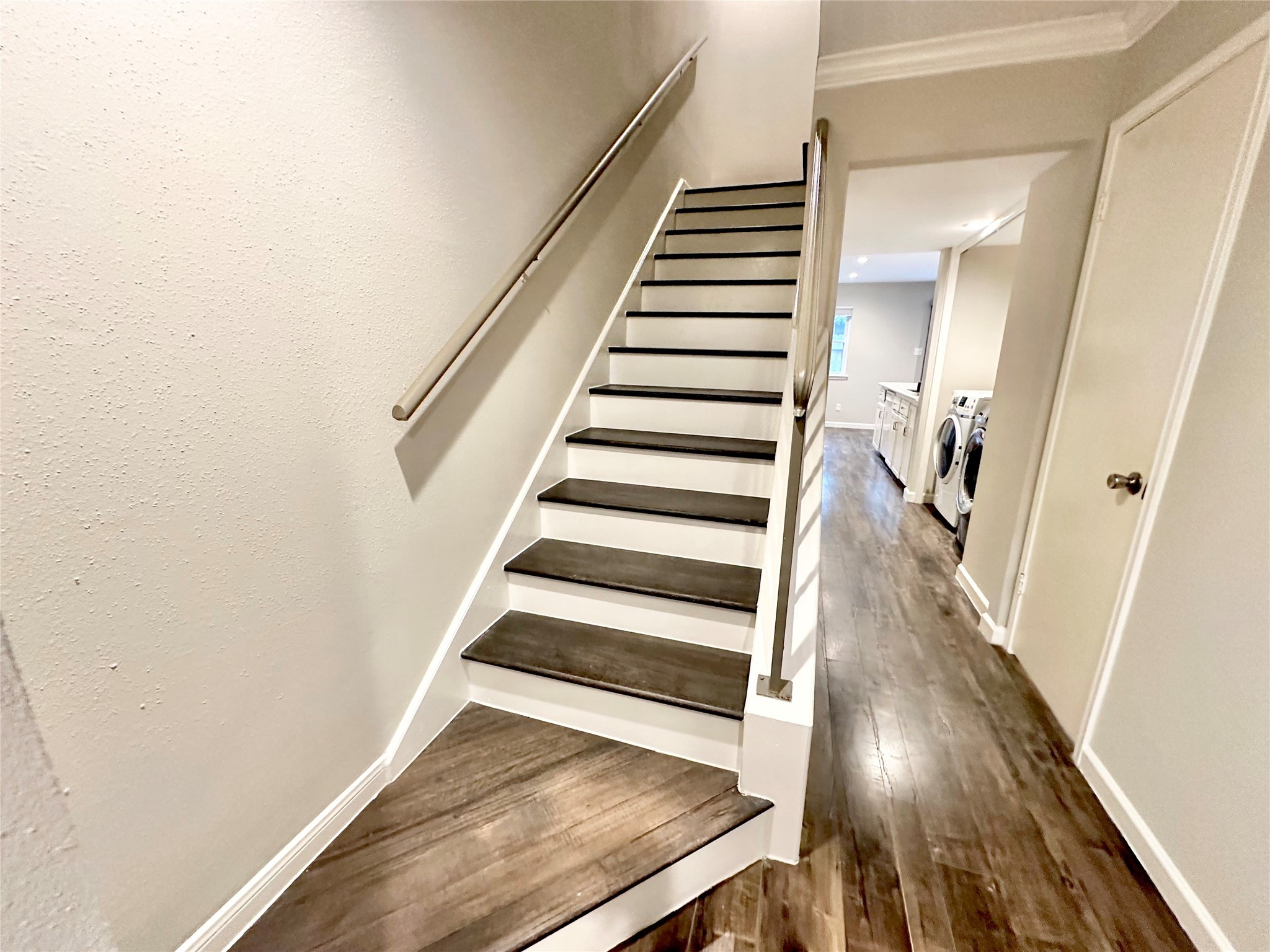 Recently updated stairs with wood stair case.