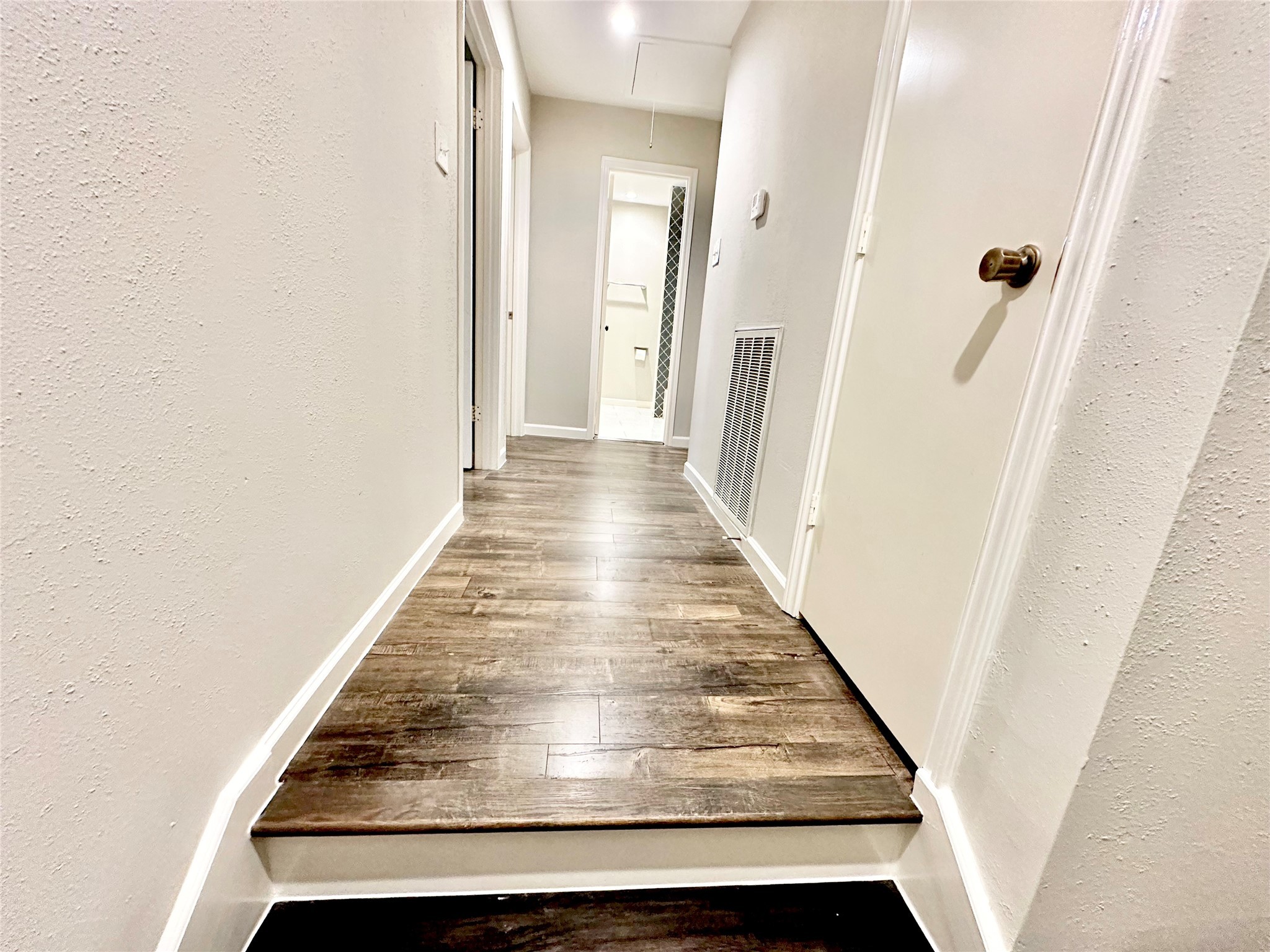 The landing to second floor also has laminate flooring. Two secondary bedrooms are located on the left and straight ahead is the hall bathroom.