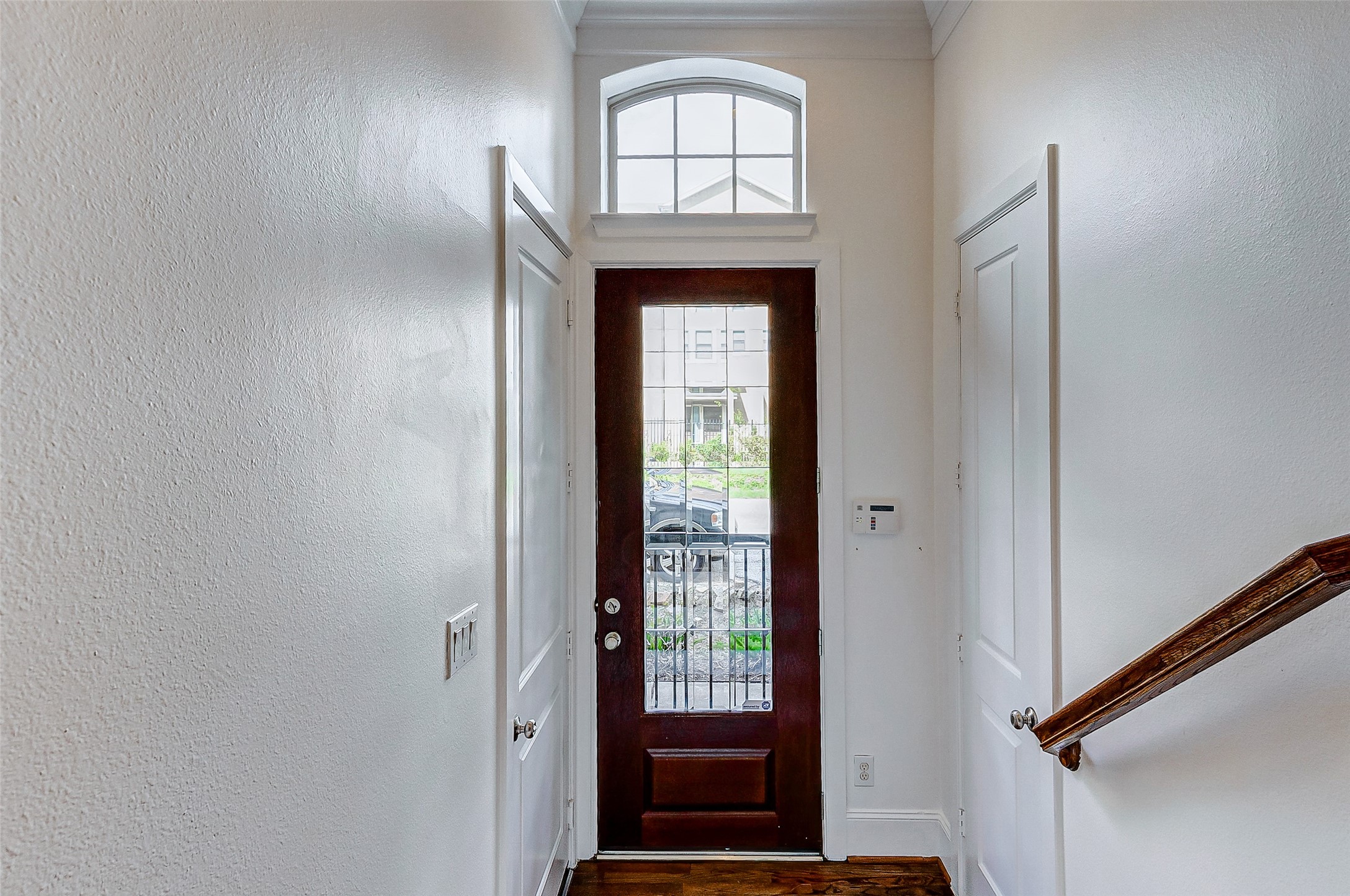 WELCOME HOME! Step inside and you will fall in love! The front foyer features tall ceilings, gorgeous wood flooring, crown-molding, and access into the 2-car attached garage and the first floor bedroom.