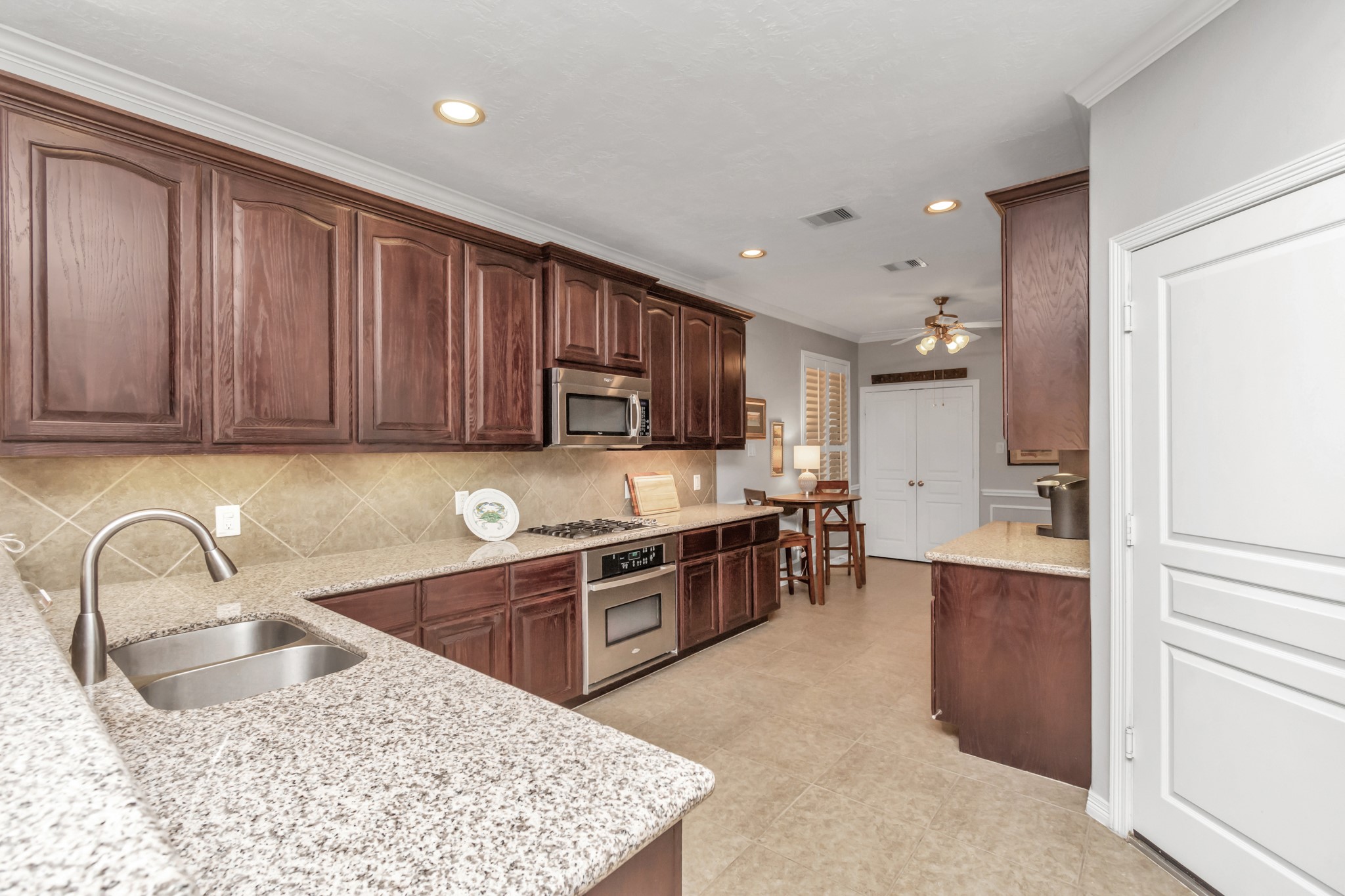 This kitchen is complete with abundant cabinetry for all your storage needs.