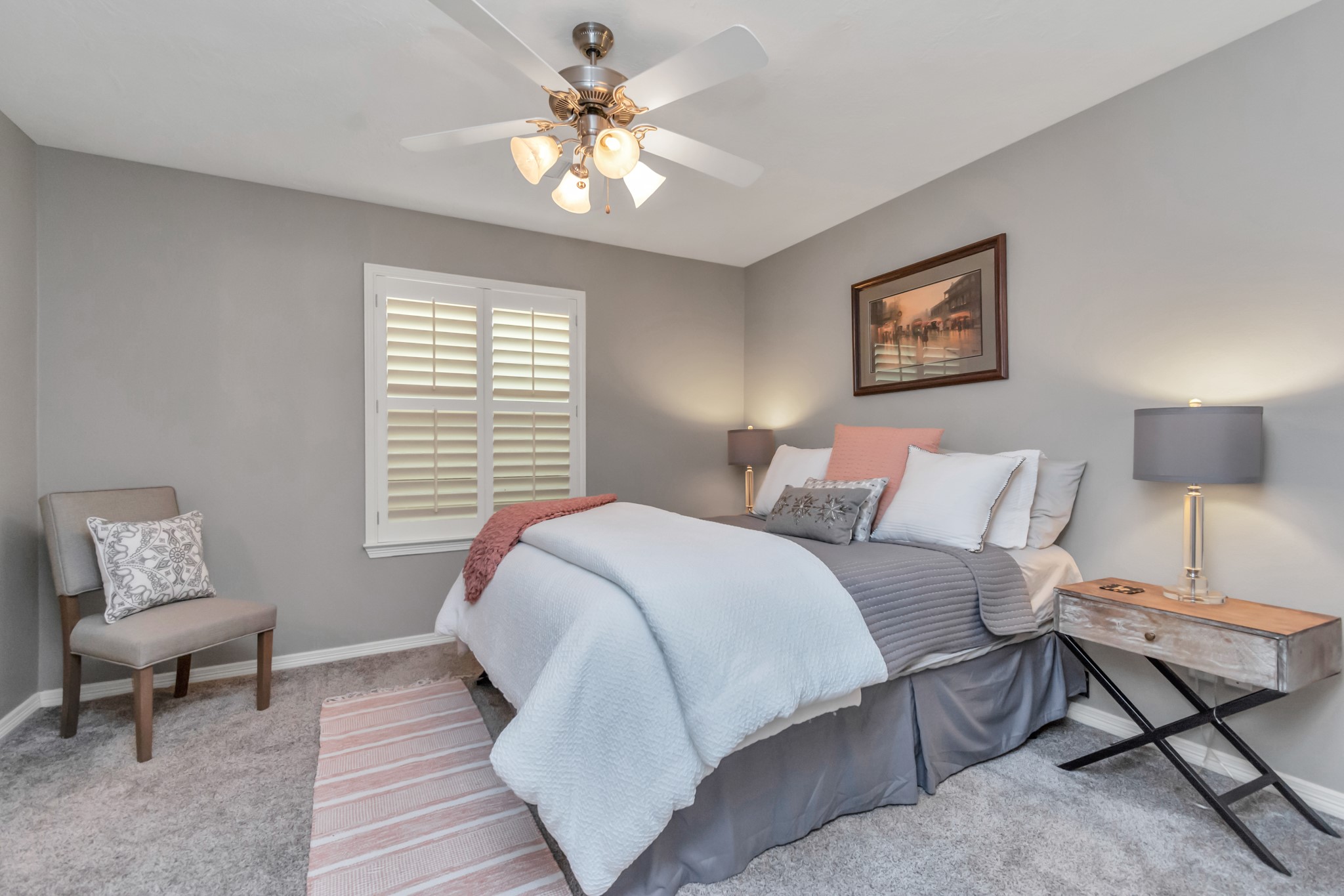 The other secondary bedroom, like all bedrooms in this home, features neutral, updated carpeting and ceiling fans. All bedrooms have substantial closets.