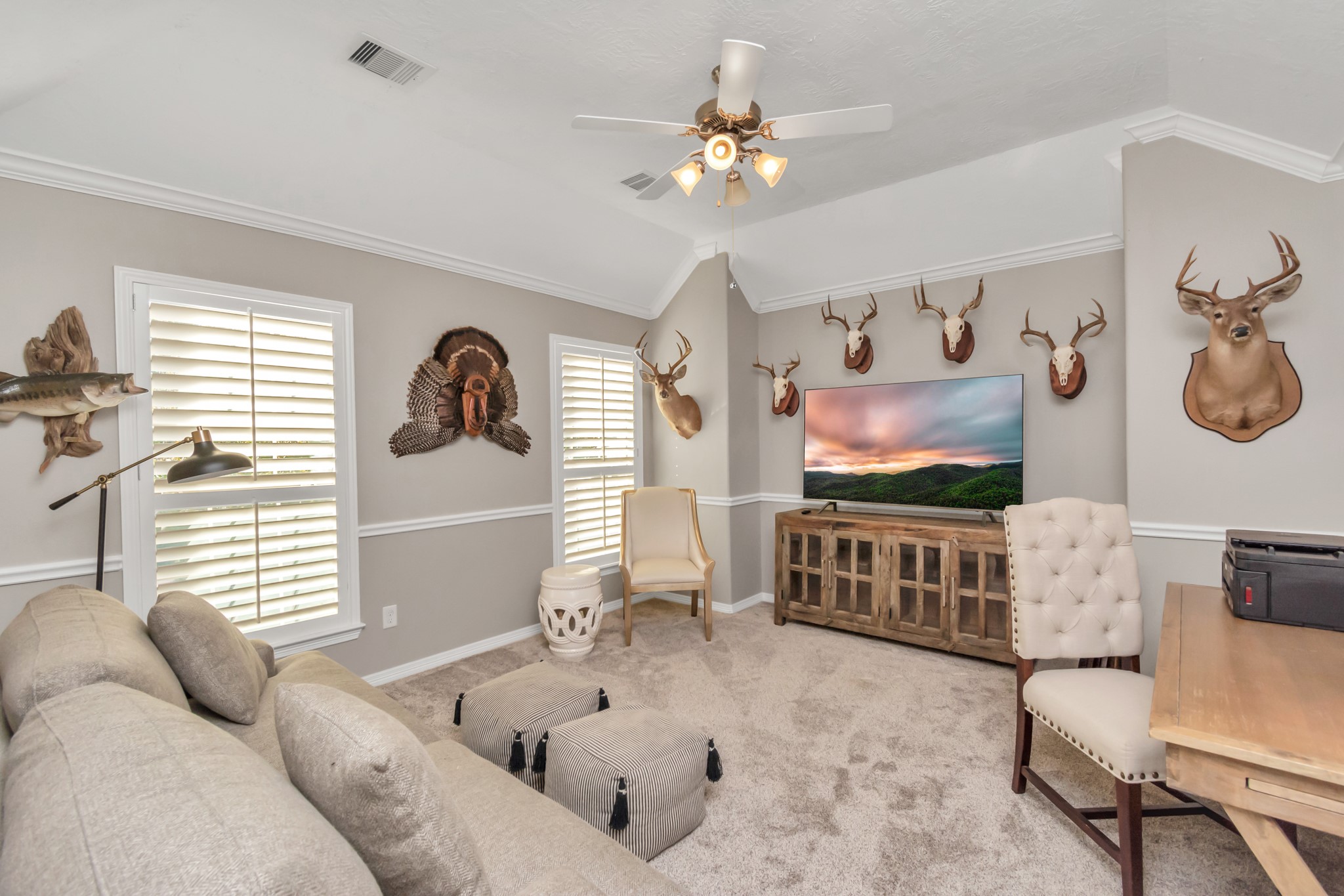 The game room is truly multipurpose, serving as a versatile space that can easily transform into a television room, playroom, or even a home office.