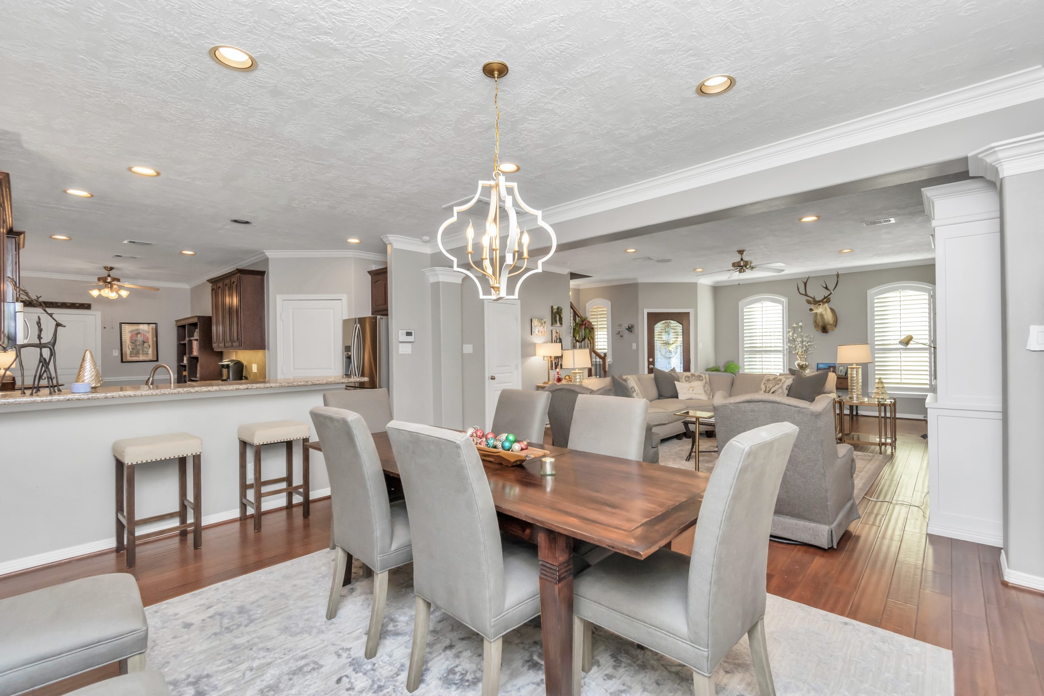 Adjacent to the den, a generously sized dining room fosters conversation and easy accessibility, creating a harmonious flow within the living space.