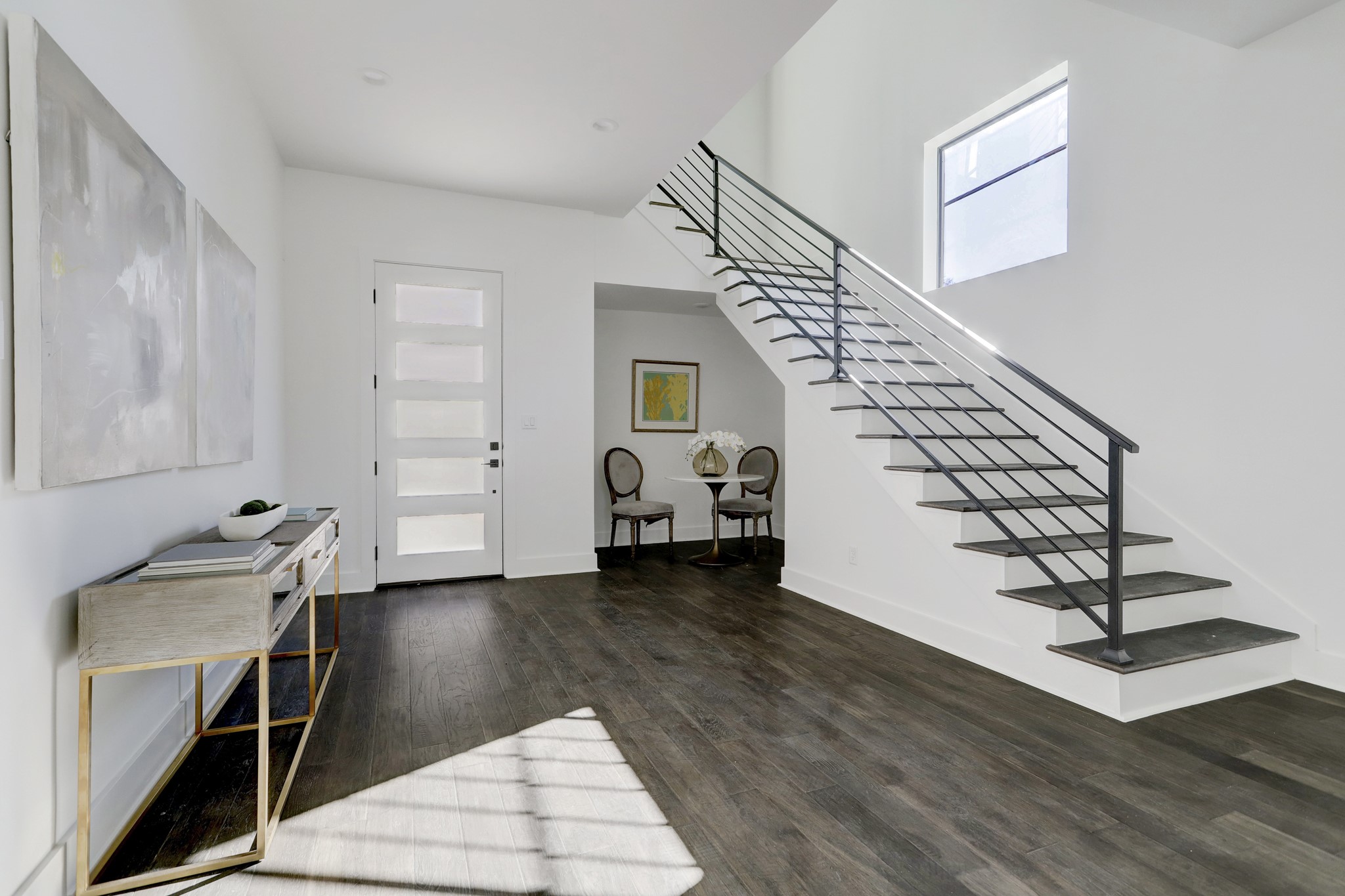 A large entry with wood floors welcomes you to the home.