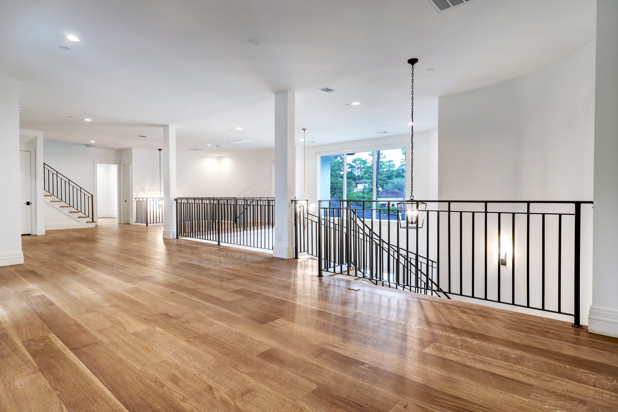 Upstairs landing area - expansive and waiting for your special decor touch. 4 bedrooms, game room, powder bath and media room upstairs.