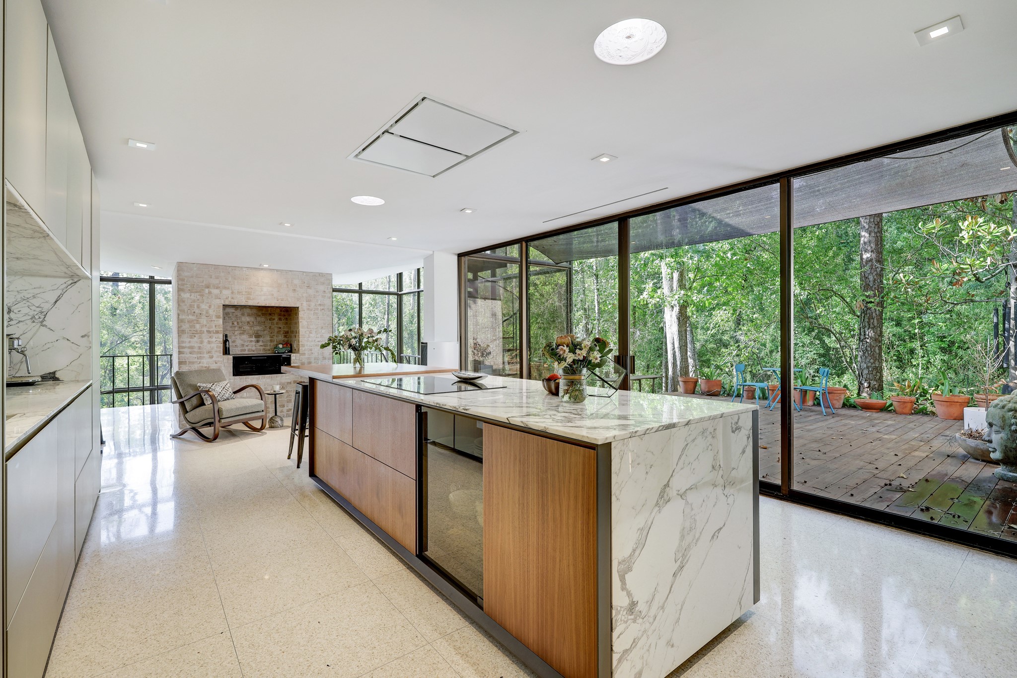 [Kitchen / Sitting Area]
Note waterfall statuario countertop on the island and wall of glass slider doors to the adjoining ipe deck.