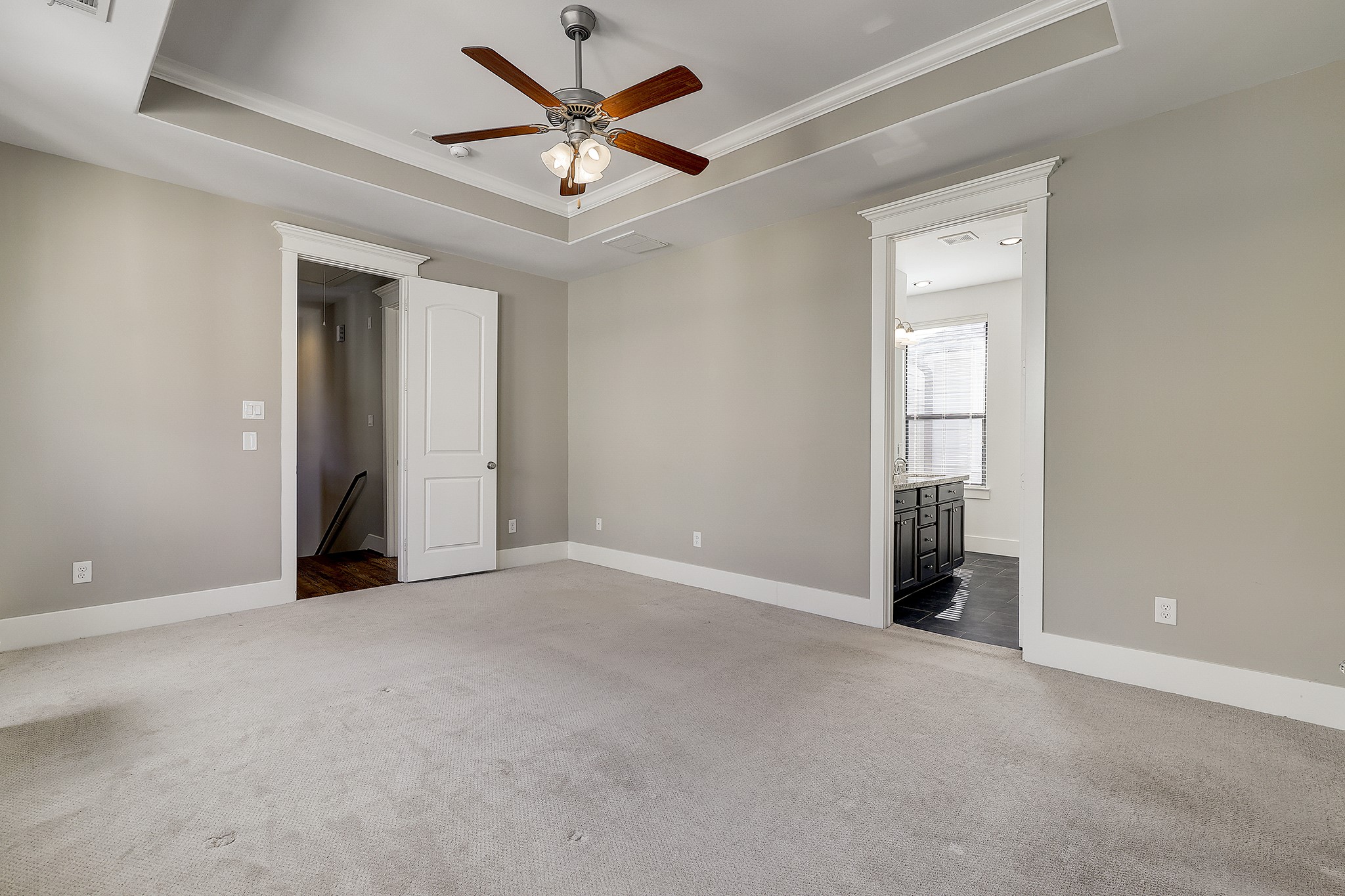Follow the fabulous wood flooring to the top floor for the primary suite sure to impress.