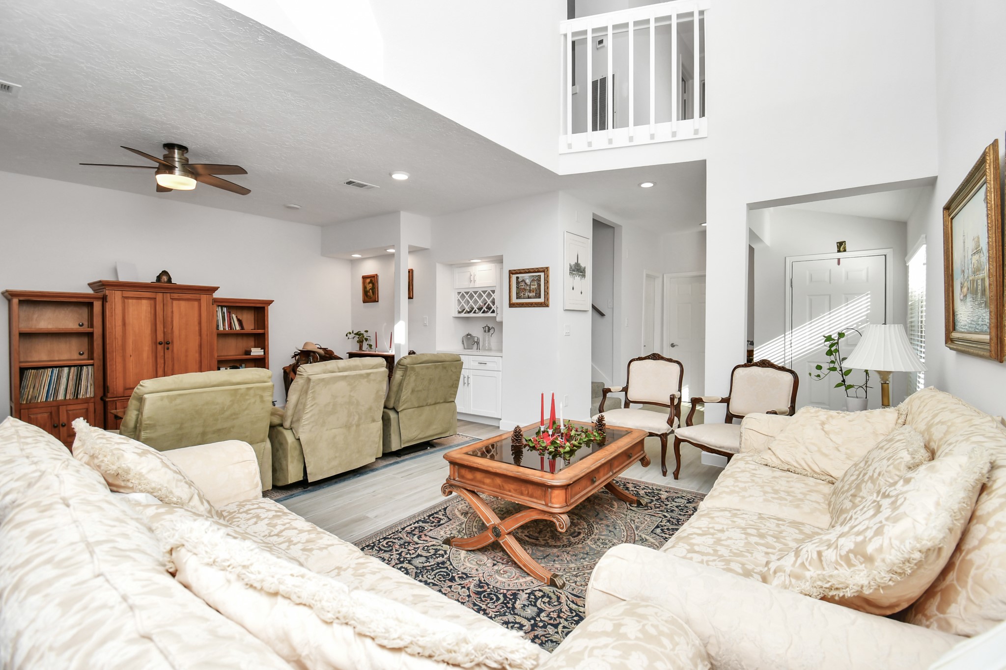 LIVING AREA - Open to Den area with its high vaulted ceilings and light airy feel.