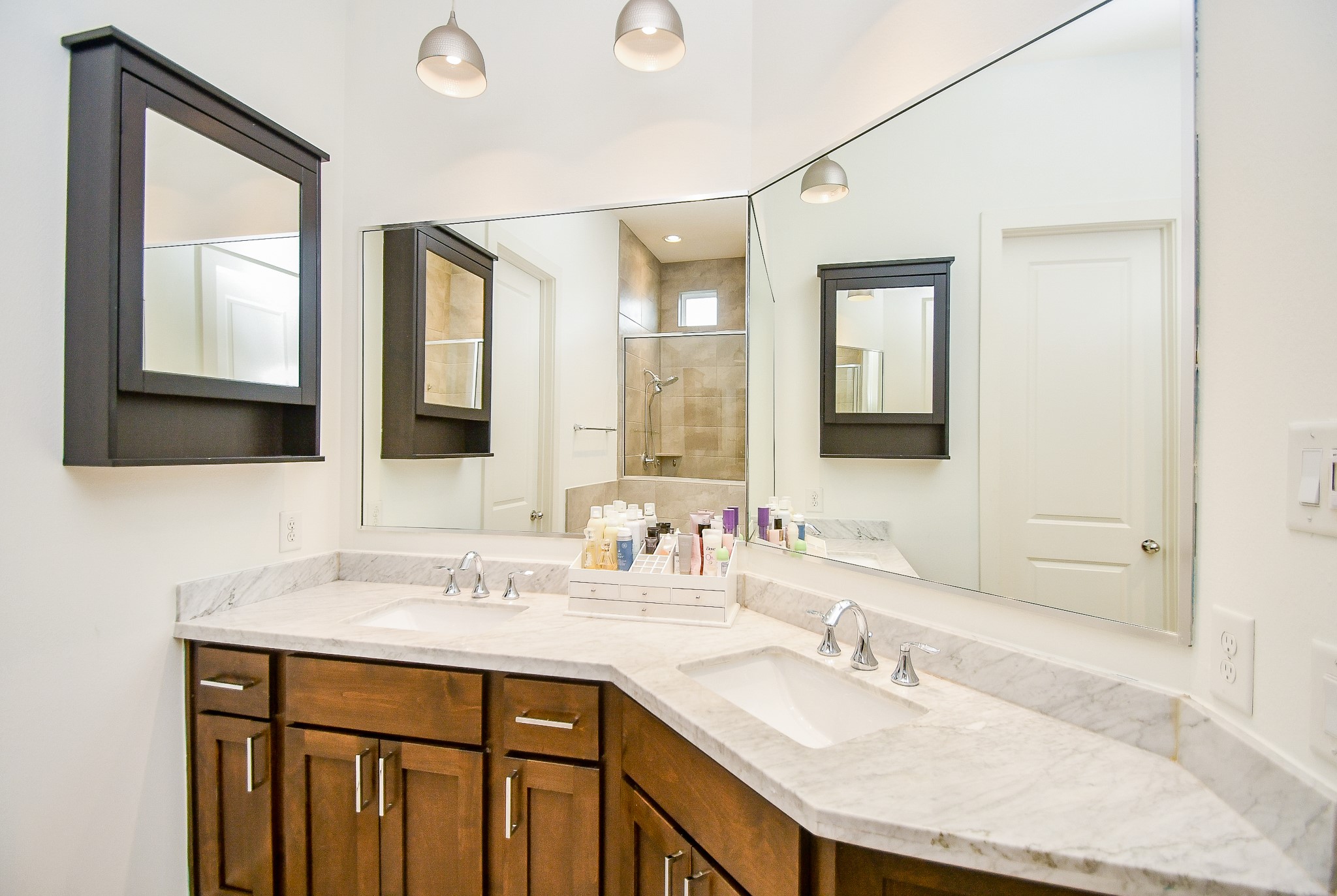 Primary bathroom features double sinks and beautiful finishes.