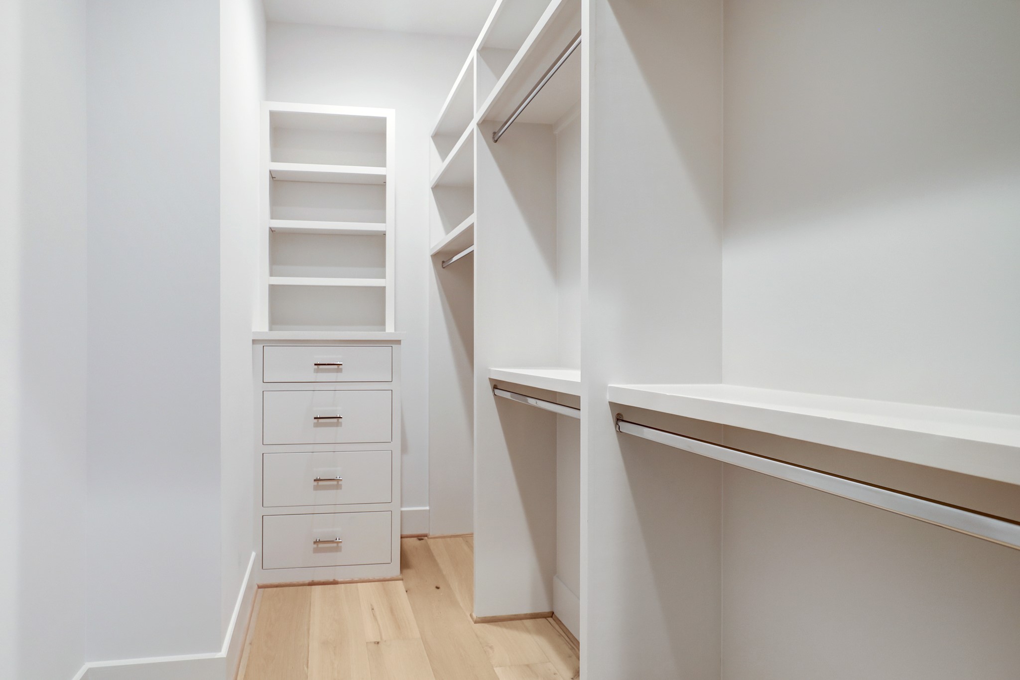 The secondary closets all have built in drawers and shelves and both long and short hanging